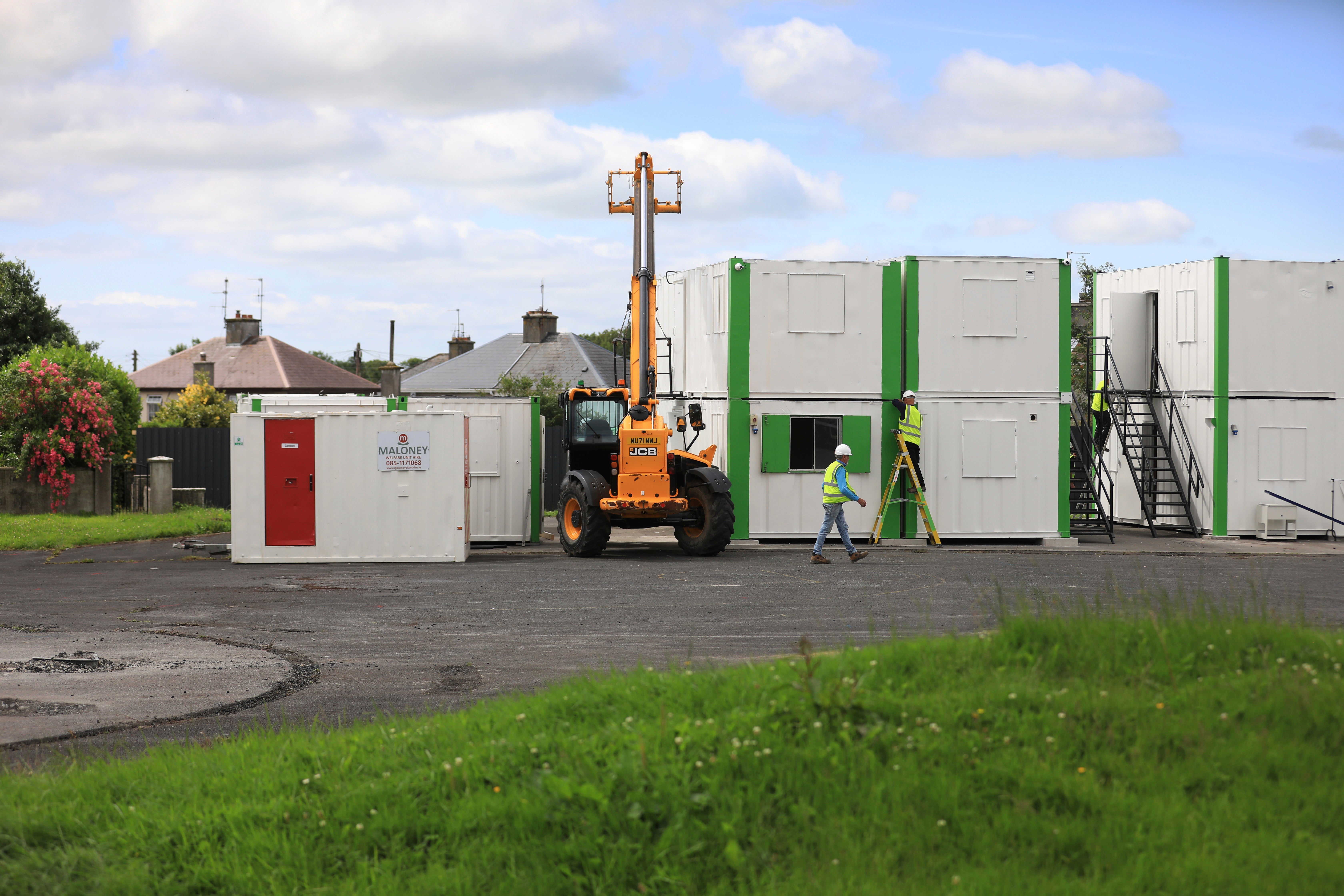 Digging equipment and workers at the site of St Mary's home for unmarried mothers, in Tuam, Ireland, July 7, 2025