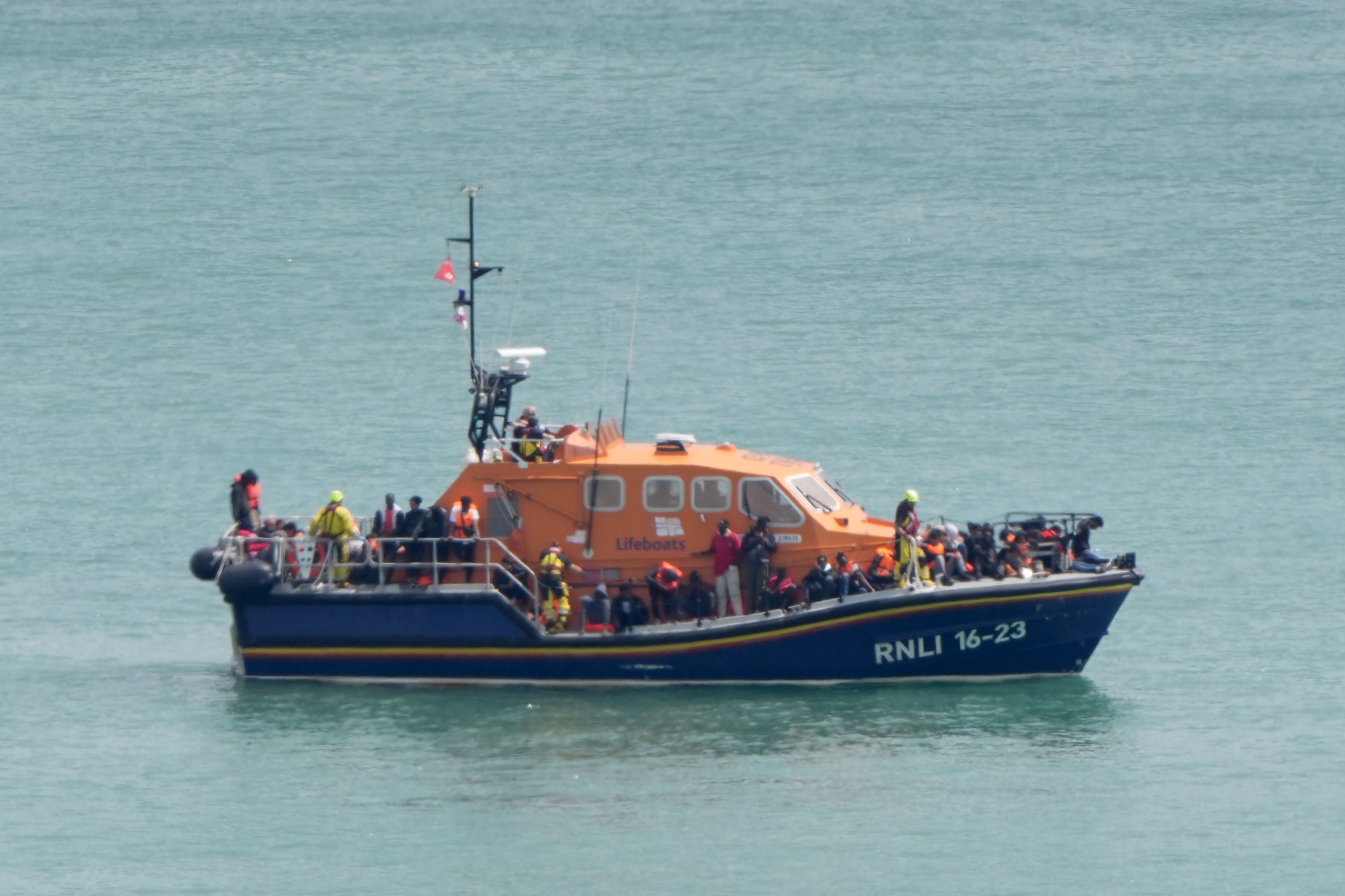 A group of migrants are brought in to the Border Force compound in Dover, Kent, from an RNLI Lifeboat following a small boat incident in the Channel