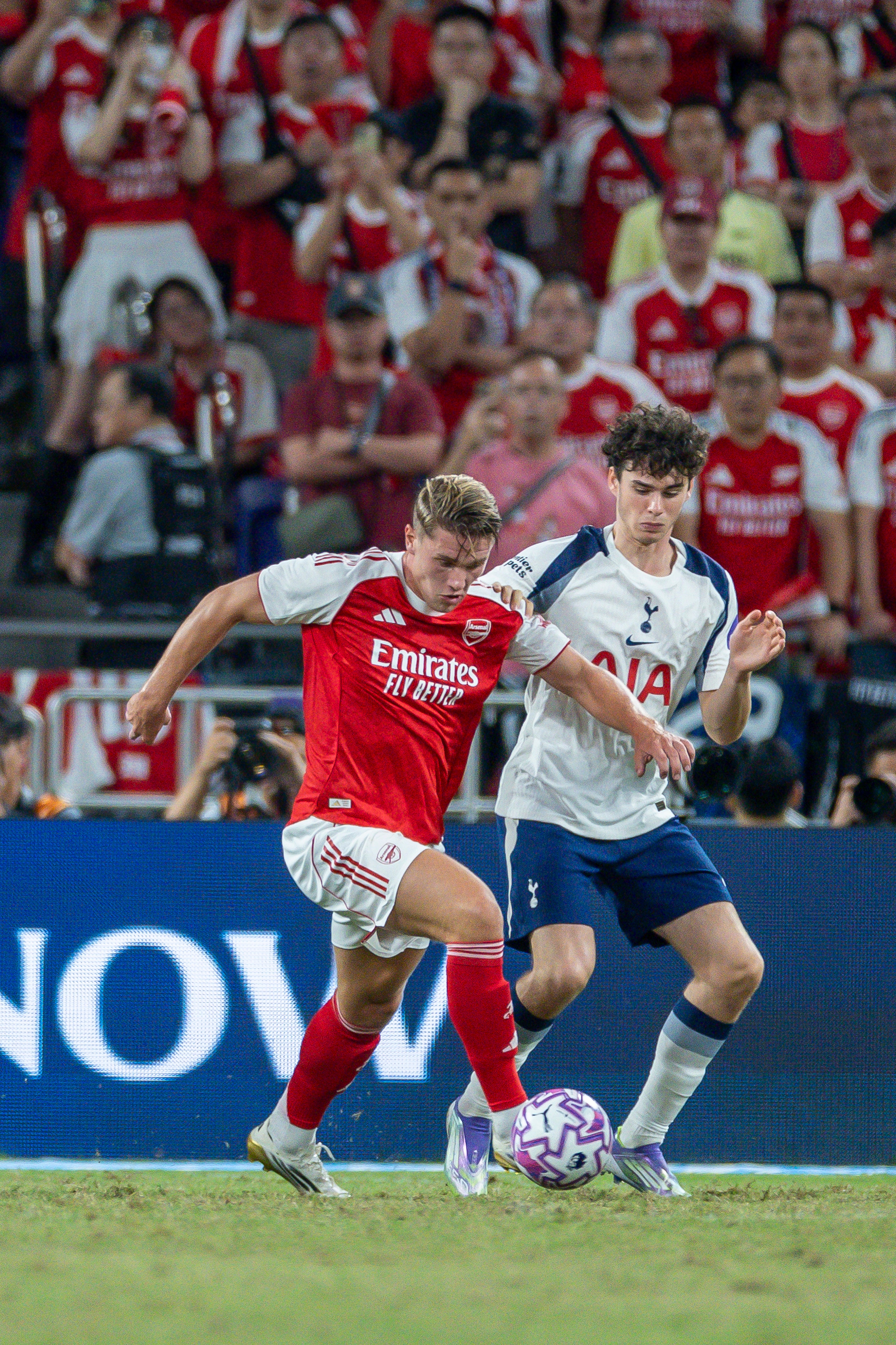 Viktor Gyokeres of Arsenal (L) handles the ball against Archie Gray of Tottenham Hotspur