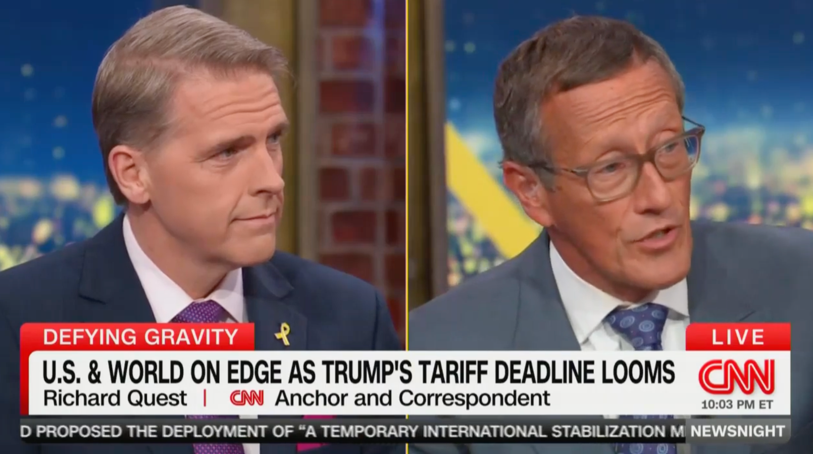 Scott Jennings (left) and Richard Quest argued over the effects of Trump's tariffs on CNN