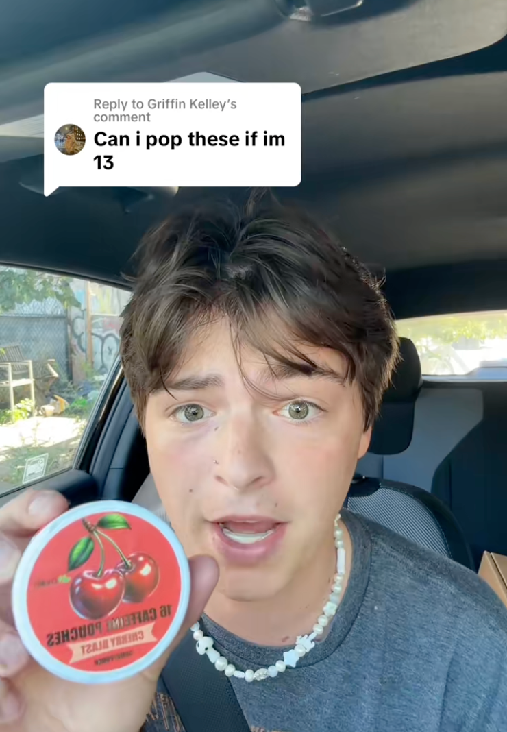 A TikTok user holds a Cherry Blast LyvWel caffeine pouch package. The user suggested kids can 'pregame recess' with the pouches