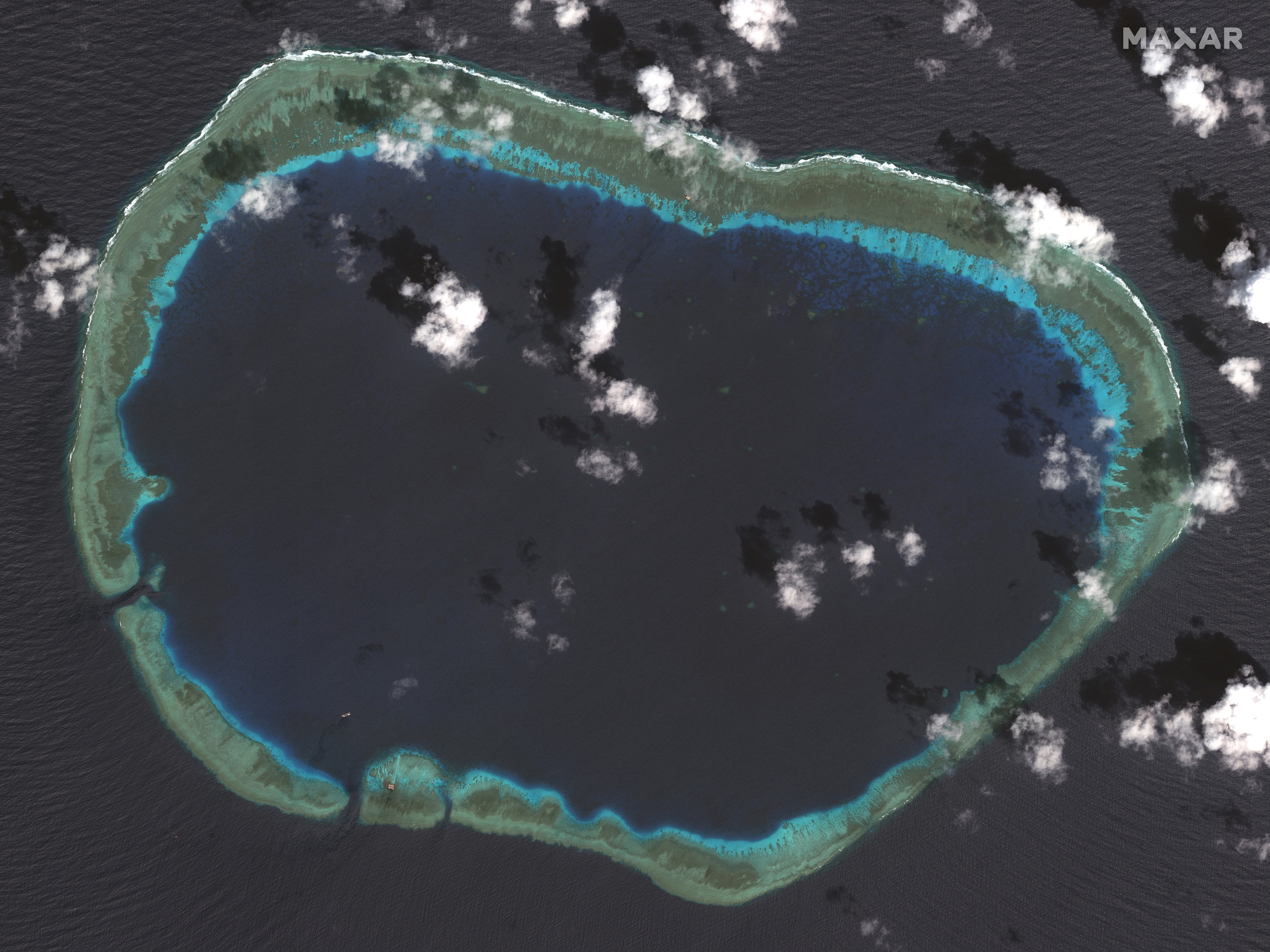 A satellite overview shows the Mischief Reef without a sign of Chinese infrastructure development or presence of Chinese facilities in October 2004