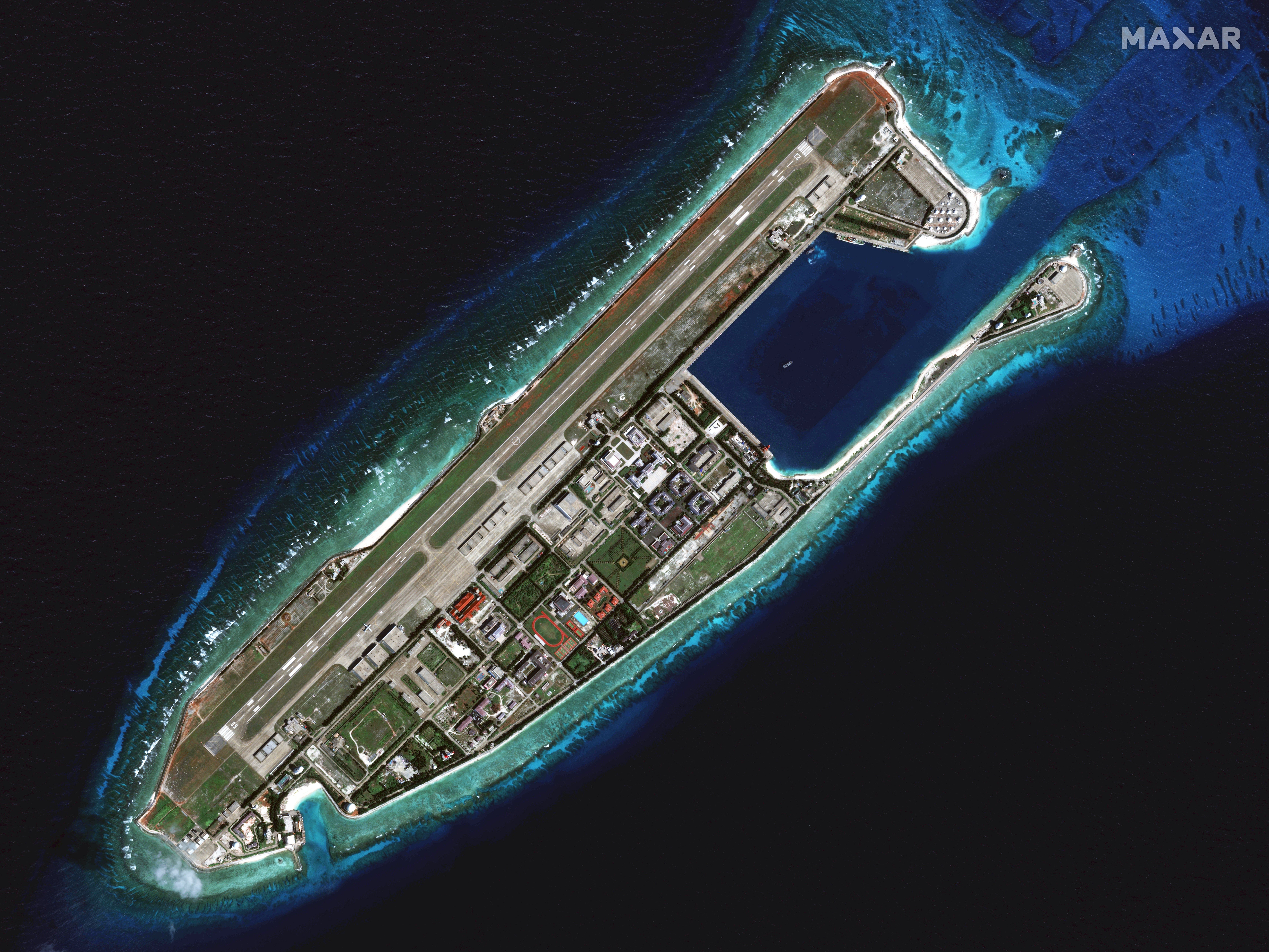 A satellite overview showing the rapid development of facilities on Fiery Cross Reef in the South China Sea as seen on 3 February 2025