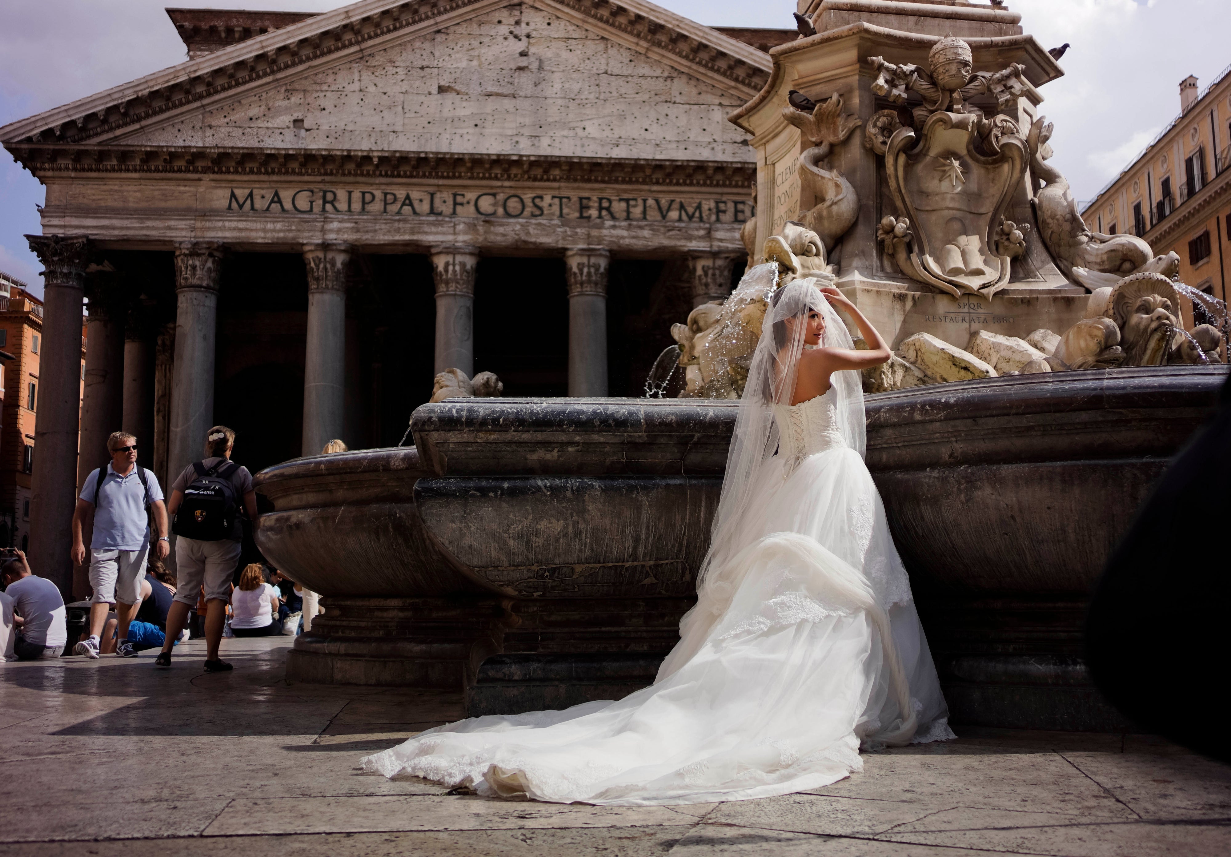 A bride poses for photos in front of Rome's Pantheon, June 28, 2013. (AP Photo/ Domenico Stinellis, File)