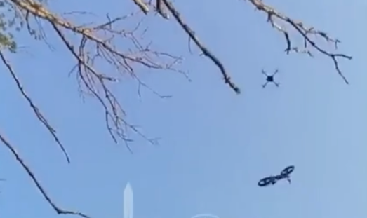 Footage showed a UAV drone airdropping the bike down to the wounded man, who was surrounded by Russian forces