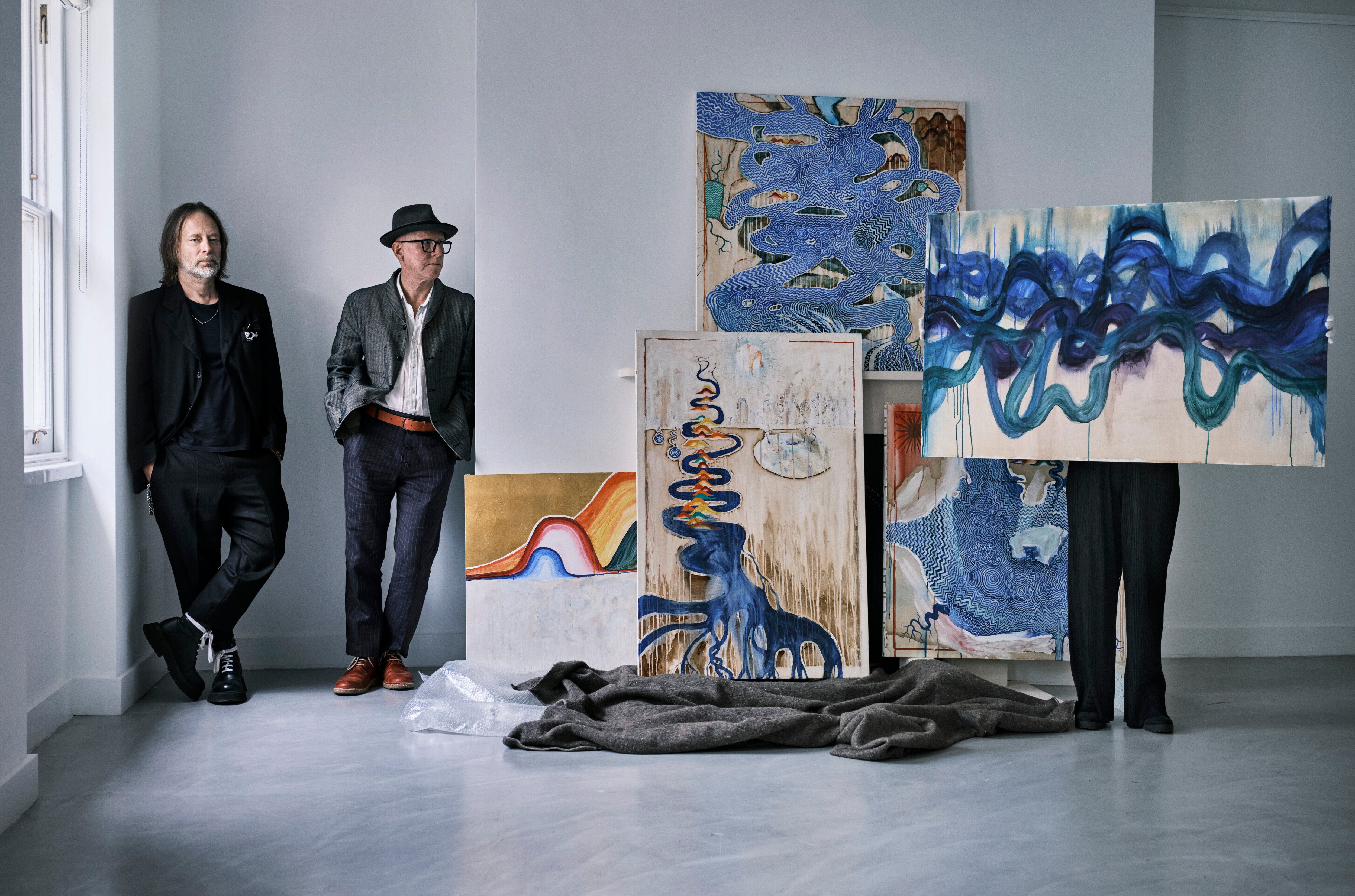 Thom Yorke (left) and Stanley Donwood with some of their artwork ready to go on display at the Ashmolean Museum, Oxford