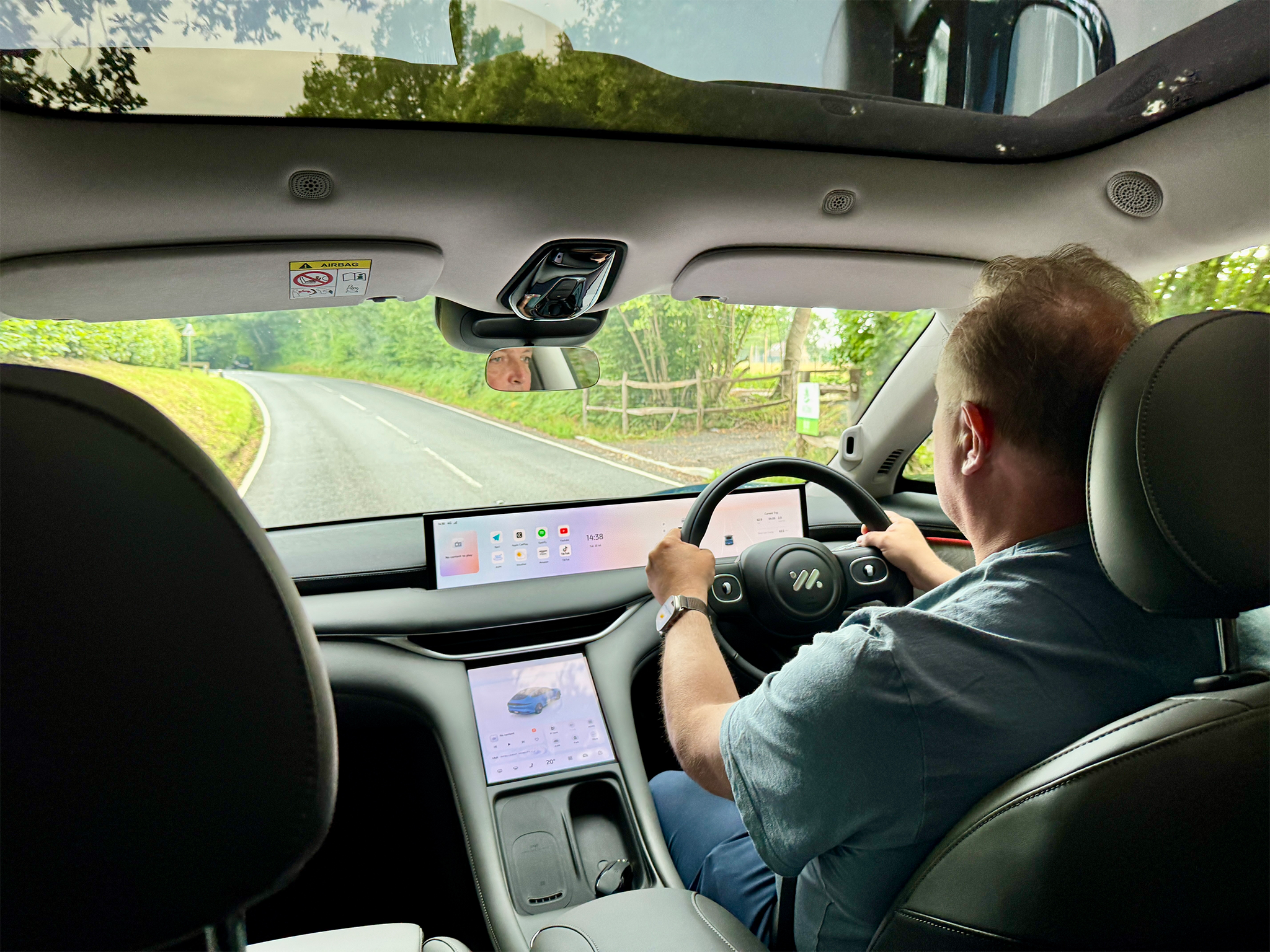 A huge, super-wide 26in display stretches across the dash for driving and infotainment duties