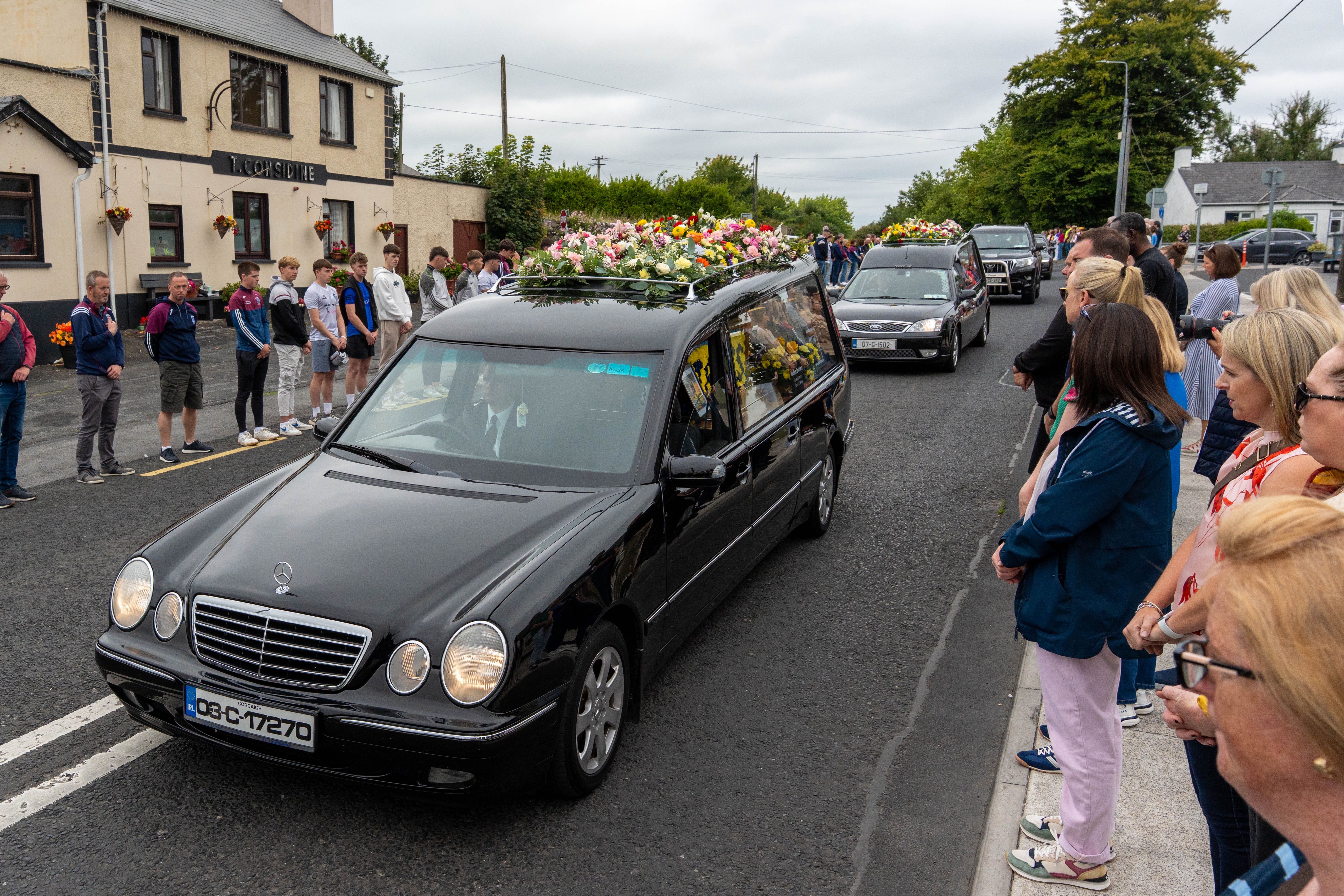 Hearses passed a guard of honour at the funeral for Vanessa Whyte and her children Sara and James Rutledge