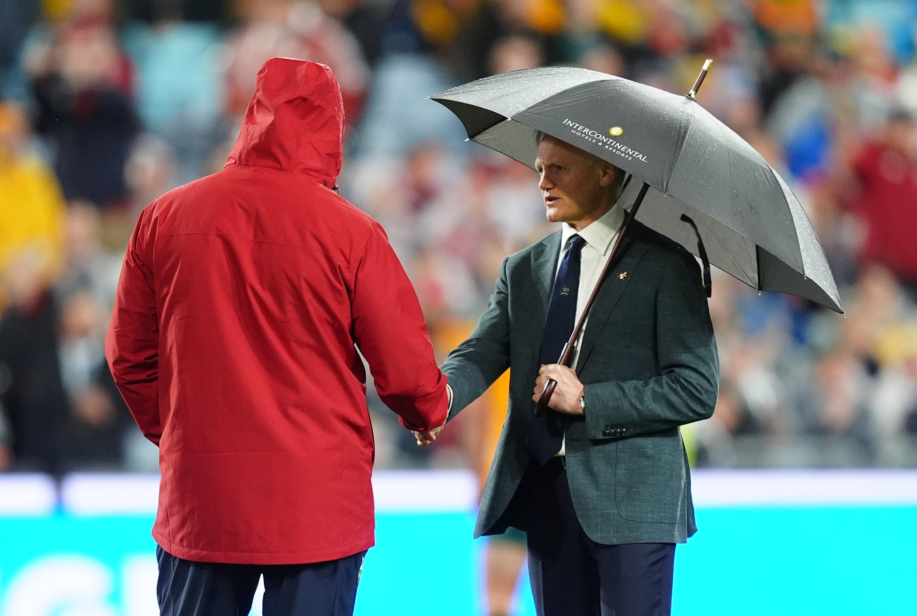 Andy Farrell and Australia coach Joe Schmidt shake hands during the final Lions Test
