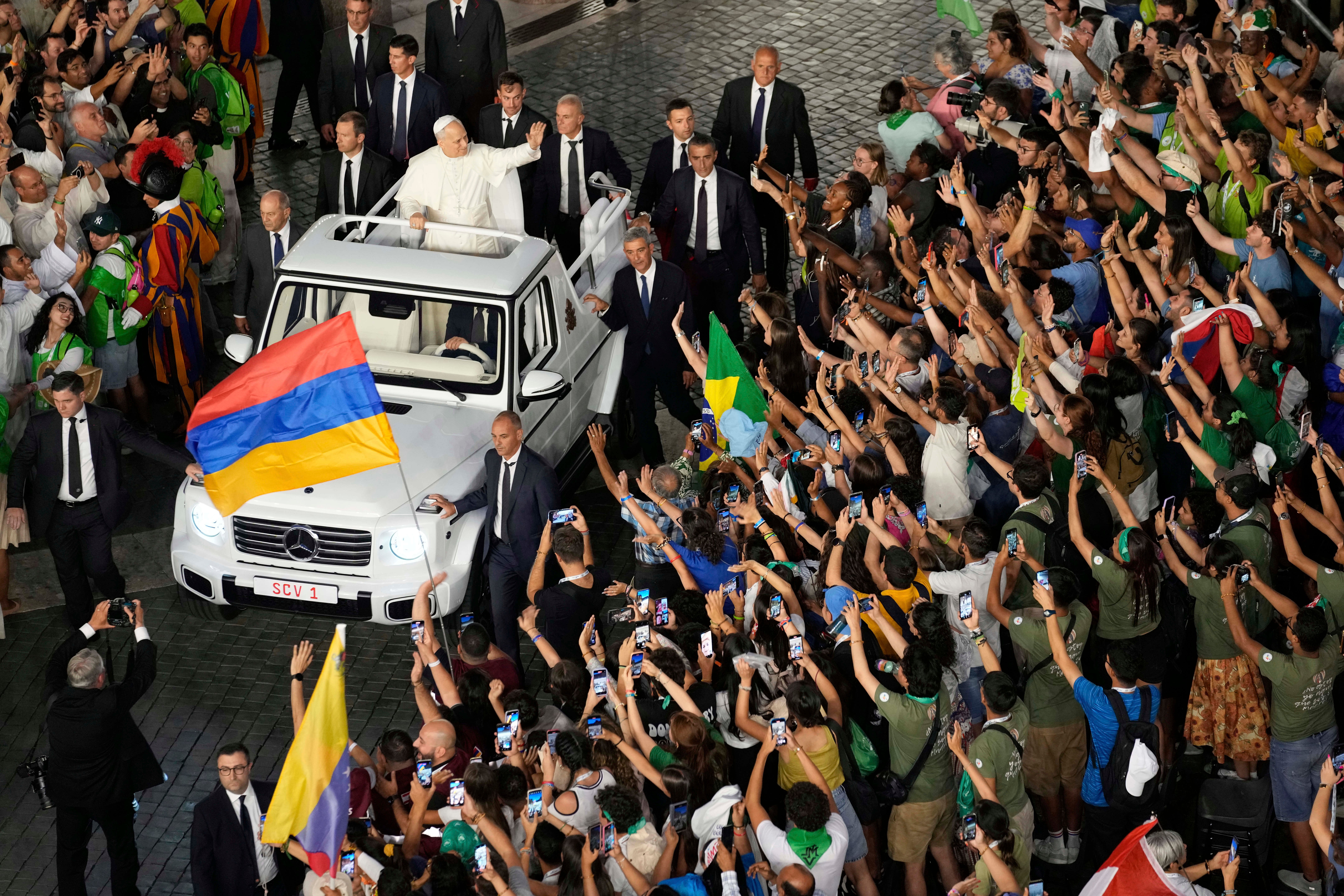 Pope Leo XIV greets faithful in St. Peter's Square at the end of a welcome mass for the Youth Jubilee at the Vatican, Tuesday, July 29, 2025. (AP Photo/Gregorio Borgia)