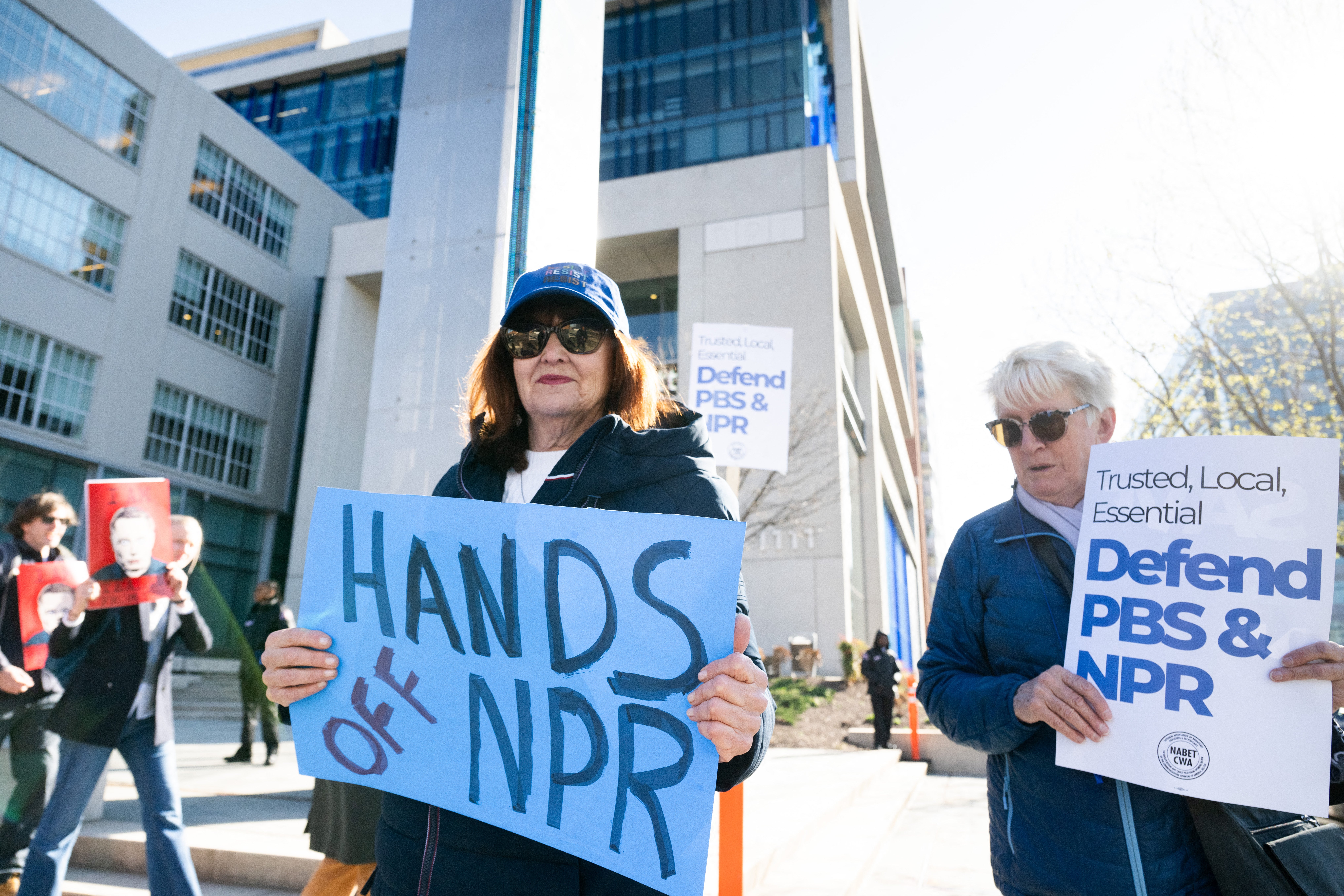 People participate in a rally to call on Congress to protect funding for U.S. public broadcasters