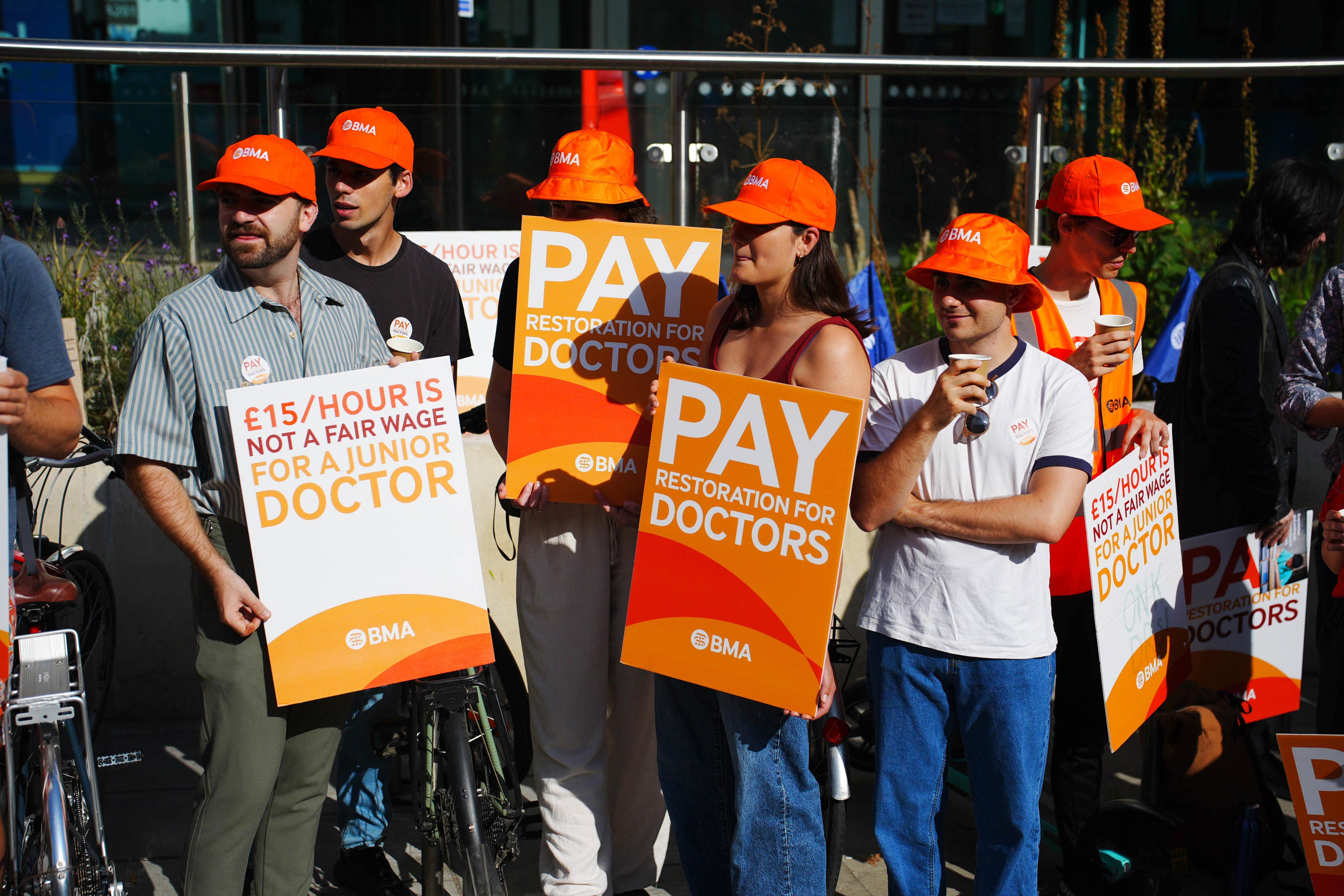 NHS resident doctors outside Bristol Royal Infirmary (PA)