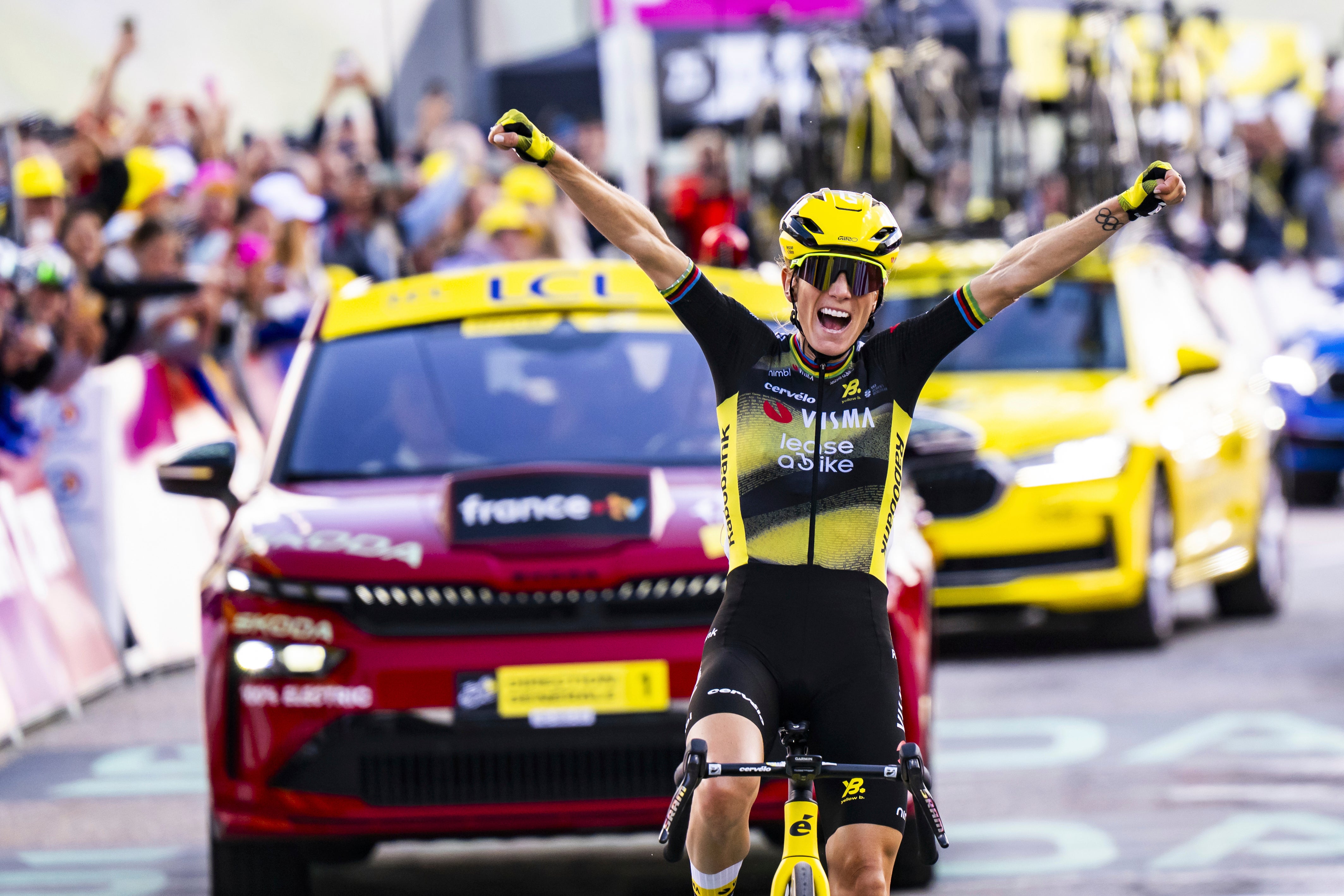 Pauline Ferrand-Prevot from France of team Visma - Lease a Bike celebrates as she crosses the finish line to win the 8th stage of the Tour de France Femmes