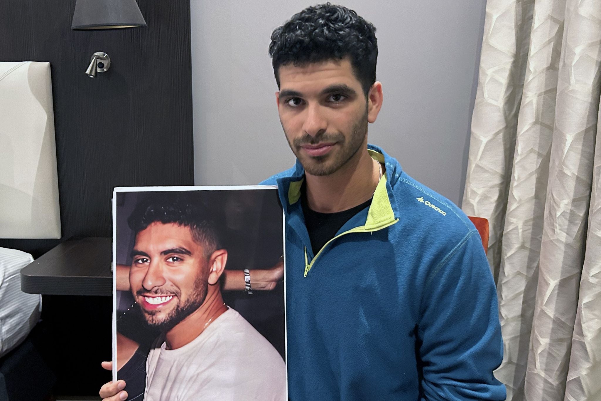 Ilay David with a picture of his brother, Evyatar David