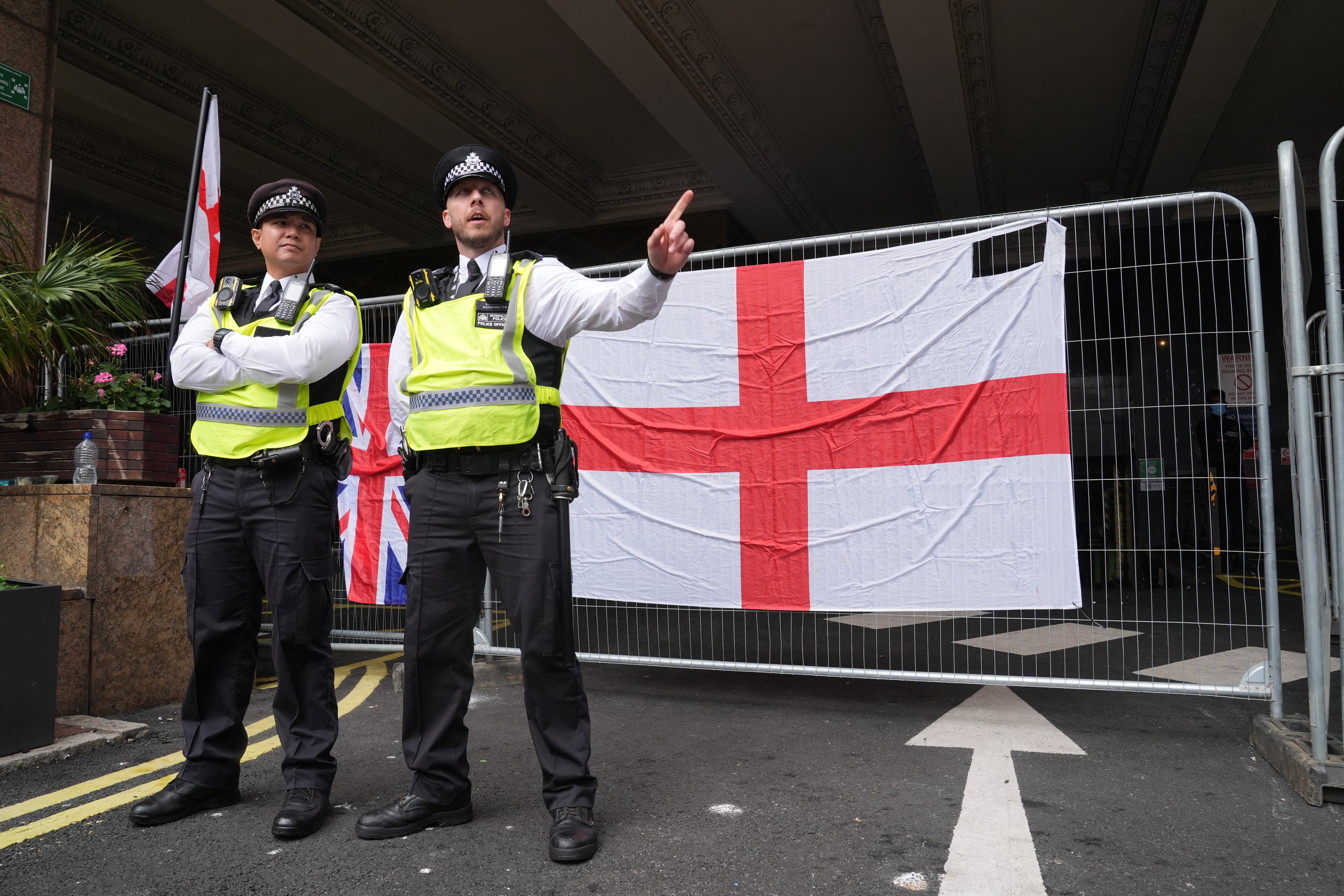 Police officers during a protest near the Britannia International Hotel in Canary Wharf