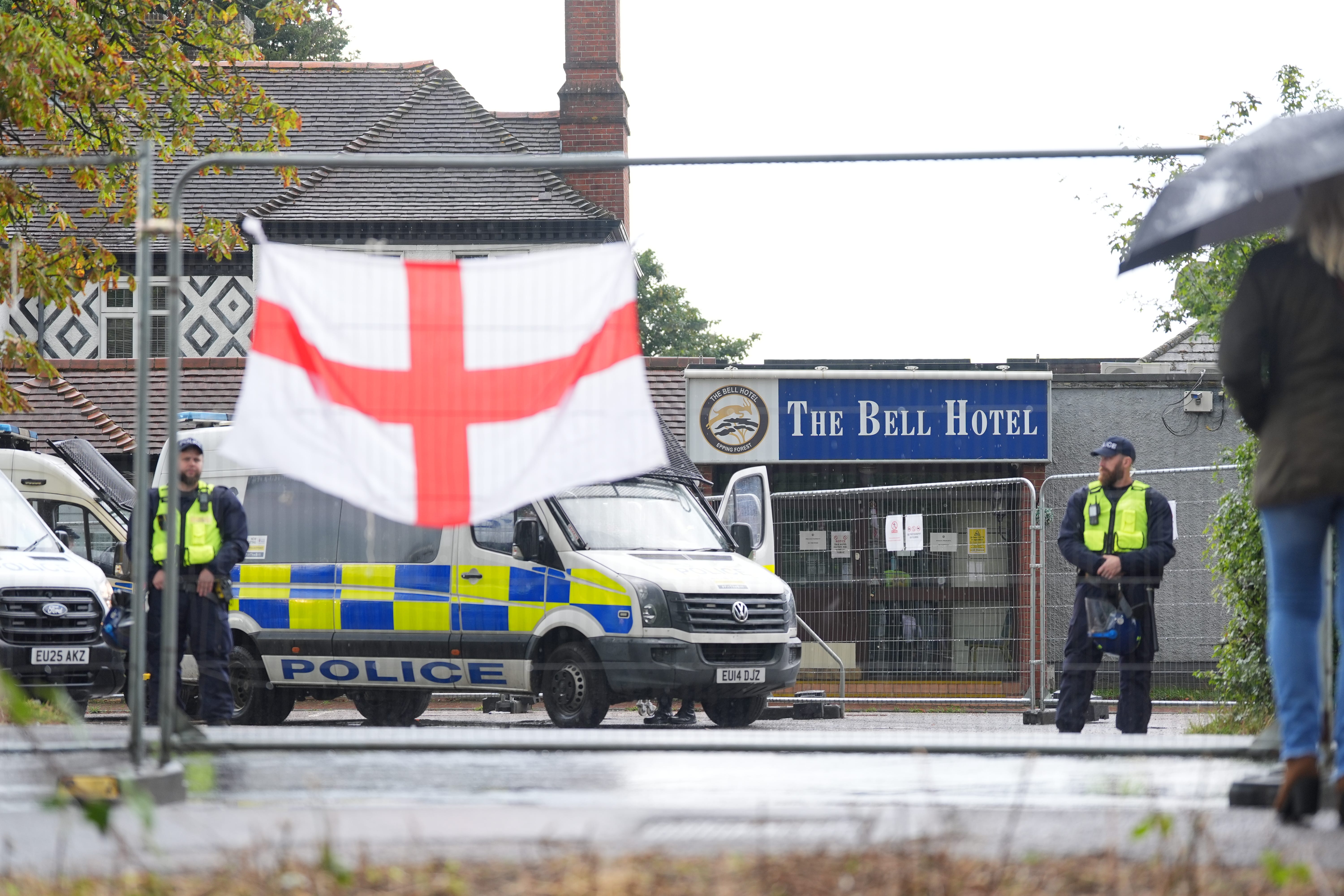 Police officers outside the former Bell Hotel in Epping (Yui Mok/PA)