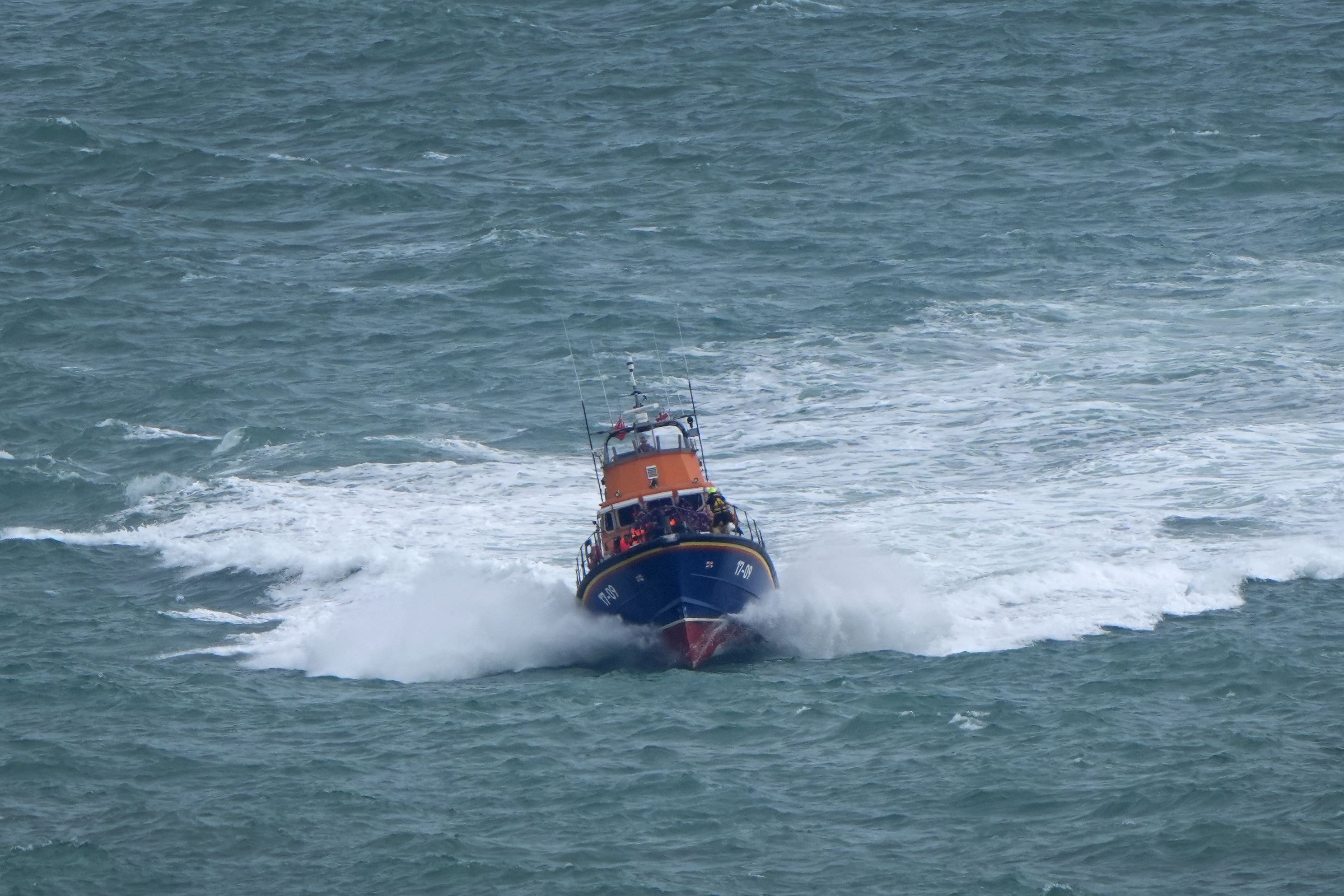 A group of people thought to be migrants are brought in to Dover (Gareth Fuller/PA)