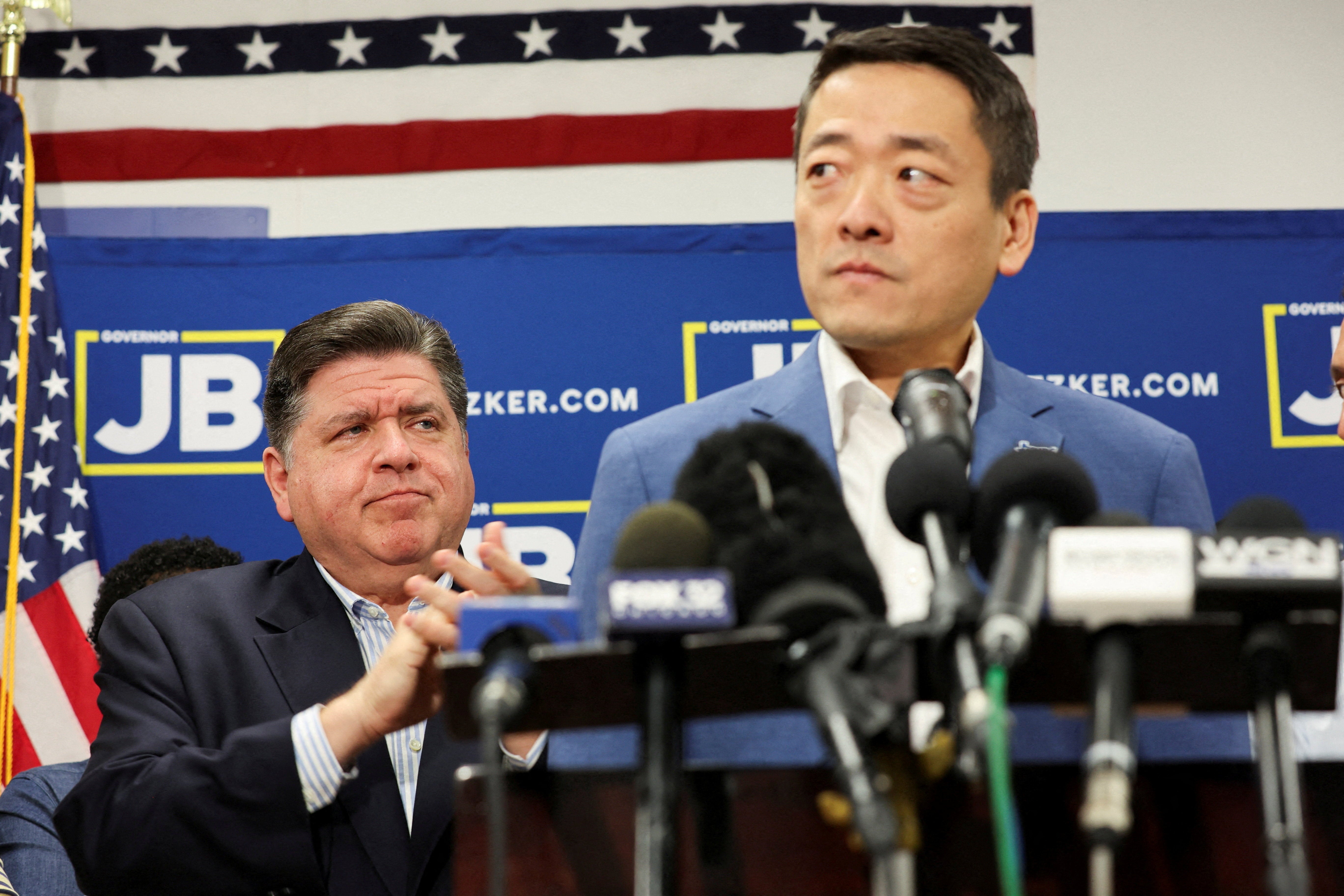 Texas State Rep. Gene Wu holds a press conference in Carol Stream, Illinois, on Sunday August 3 2025 after fleeing a Republican gerrymandering push as Illinois Governor JB Pritzker looks on