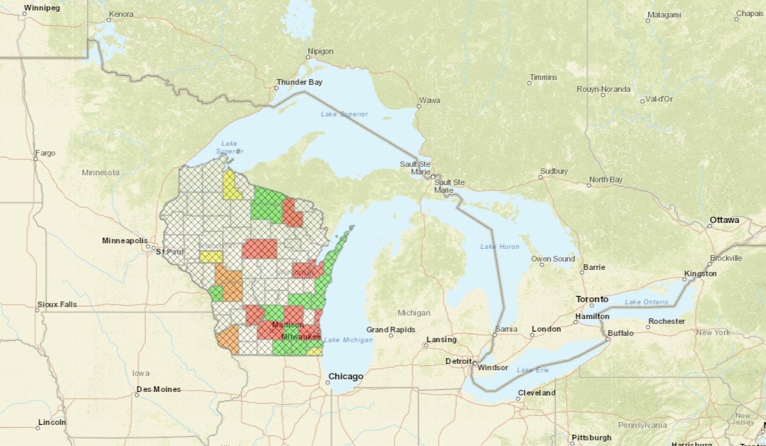 Smoke was lingering in Wisconsin on Monday. The red counties shown on this map still have 'unhealthy' air