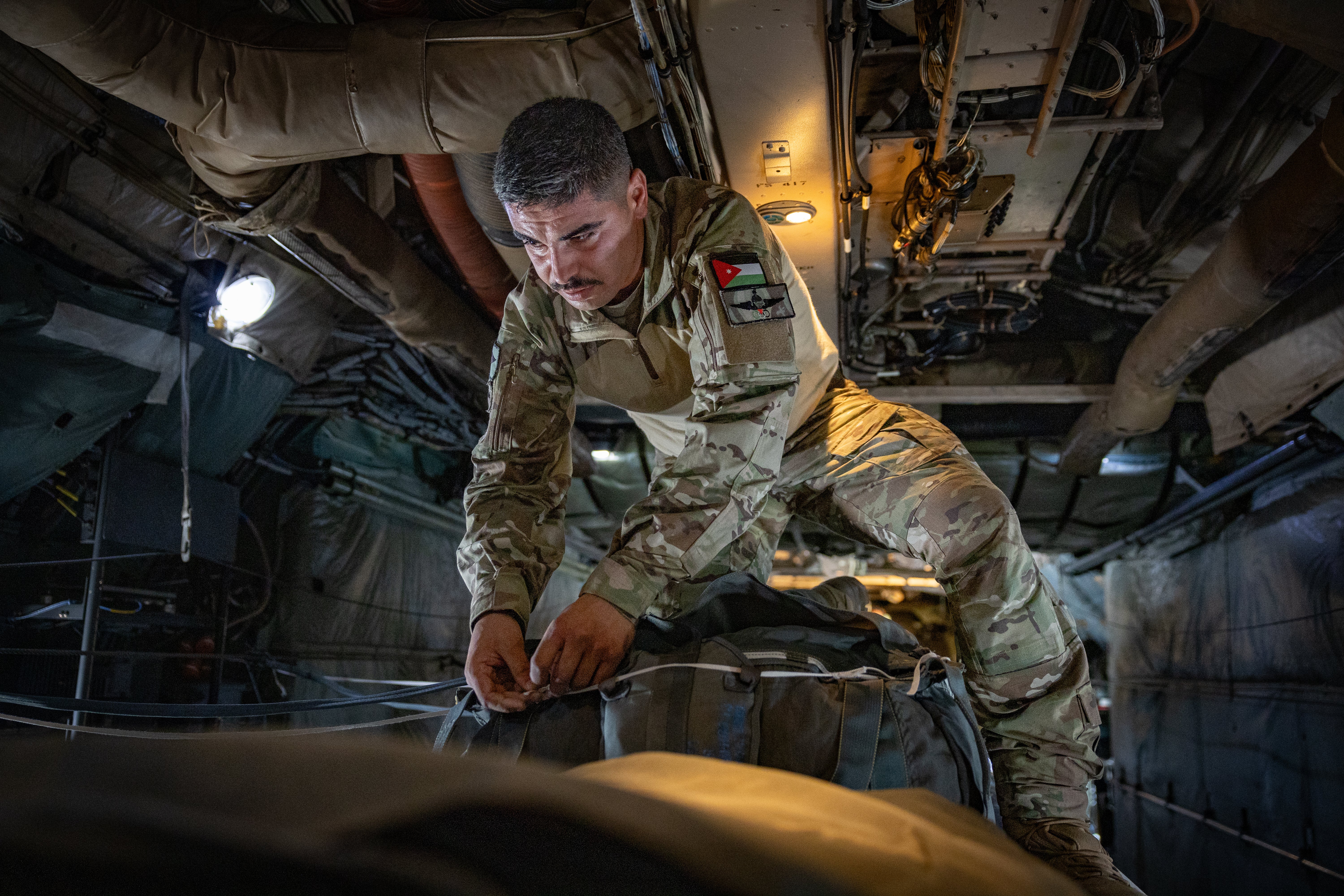 Jordanian airmen prepare the aid drop over Gaza