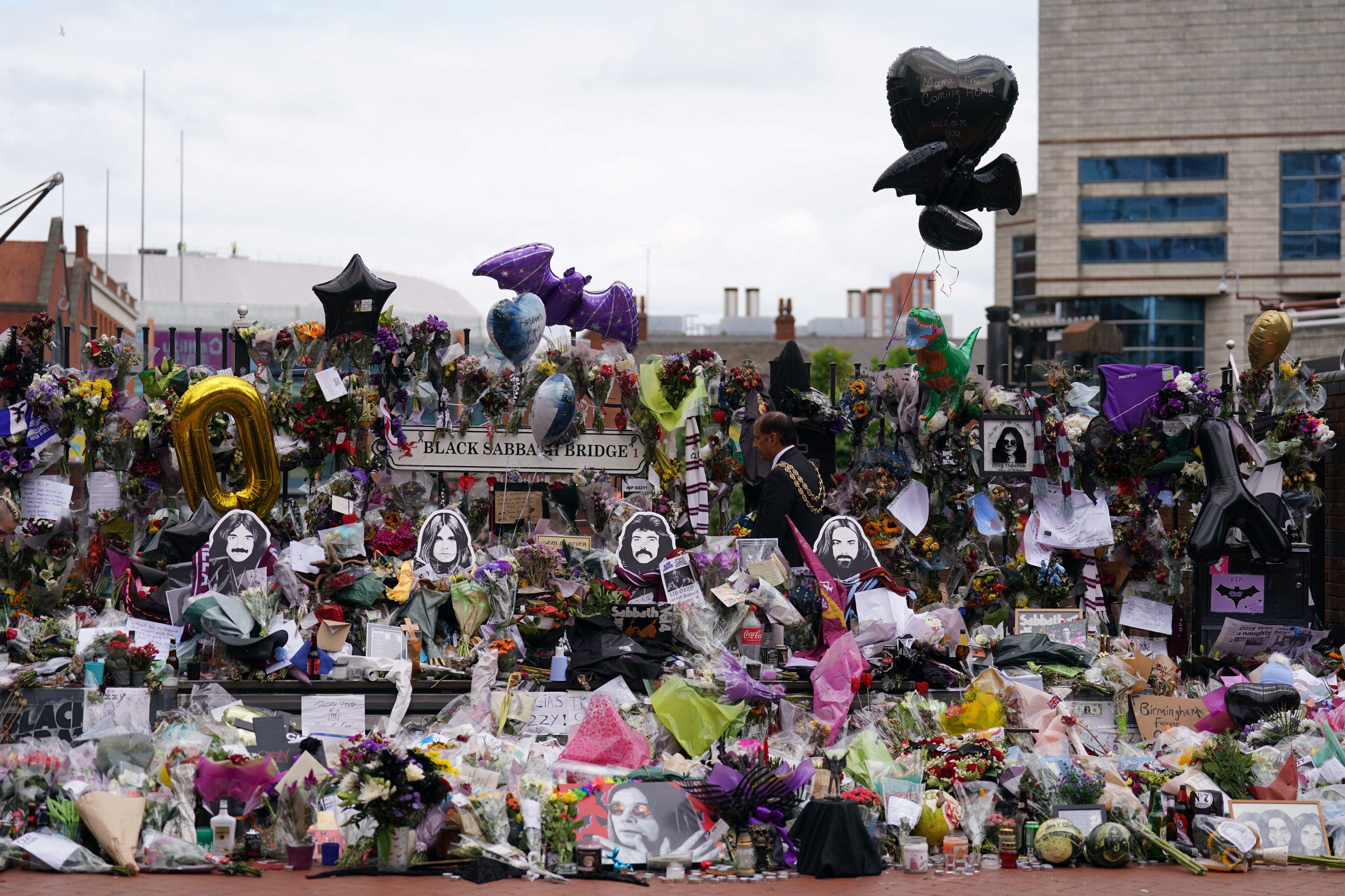 Messages and flowers left at the Black Sabbath Bridge