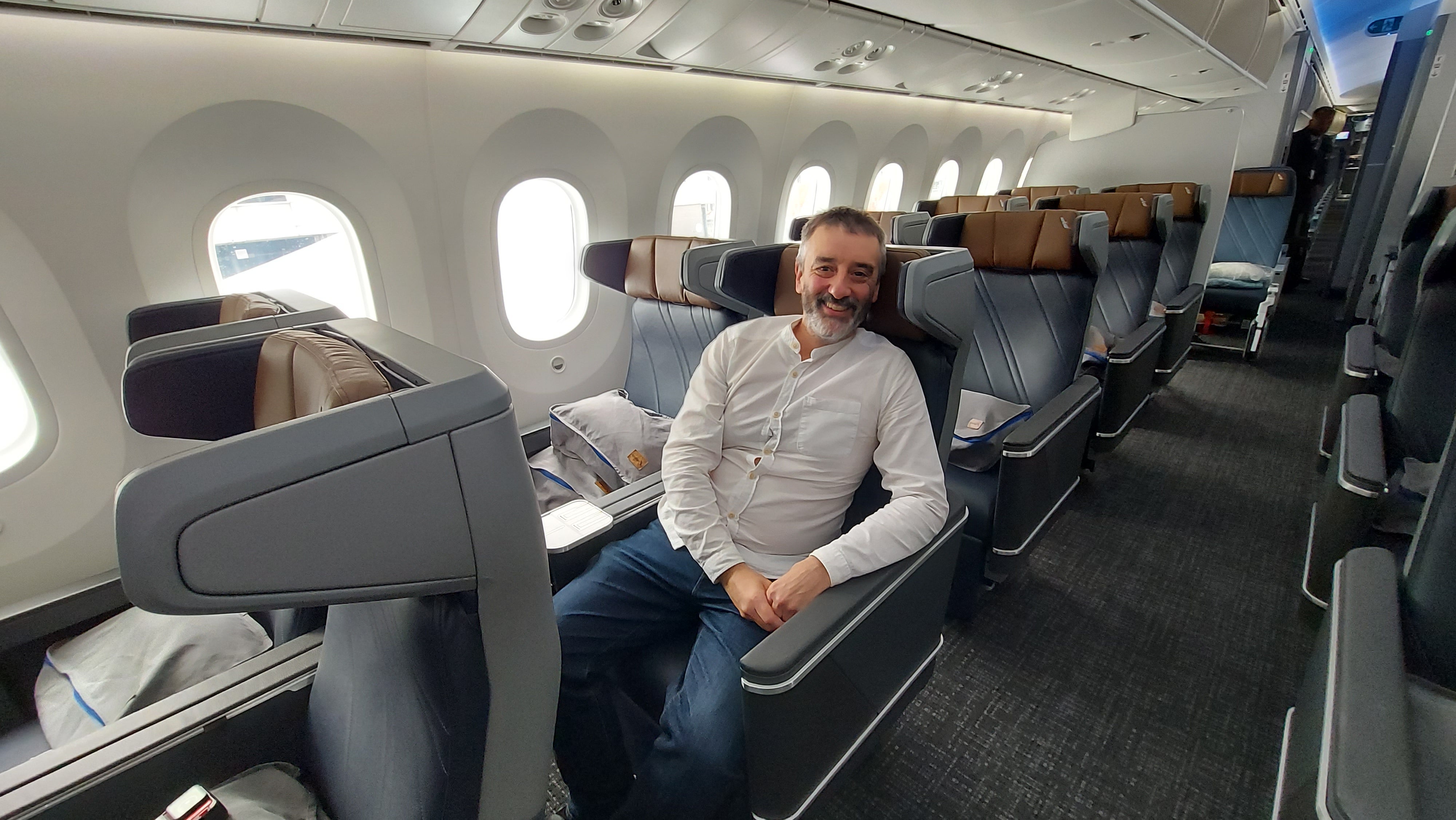 The premium economy seats have thoughtful 'privacy dividers' that help shield passengers from their neighbors