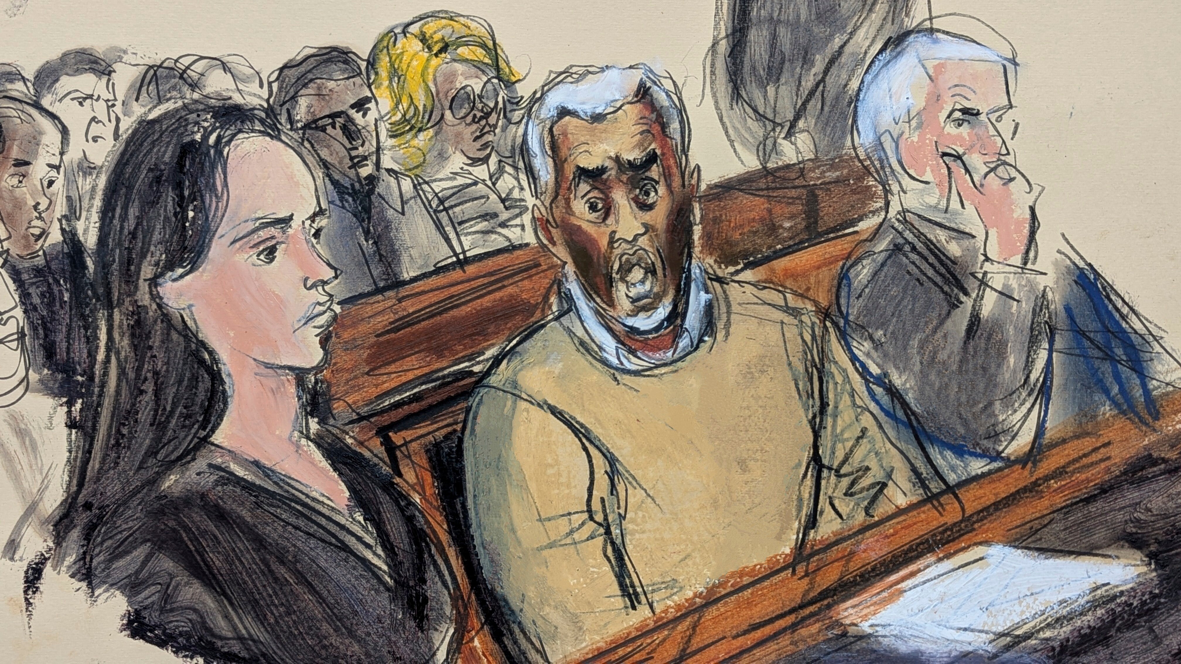 In this courtroom sketch, flanked by defense attorneys Teny Geragos, left, and Brian Steel, right, Sean "Diddy" Combs, center, reacts after he was denied bail on prostitution-related offenses, July 2, 2025, in Manhattan federal court in New York