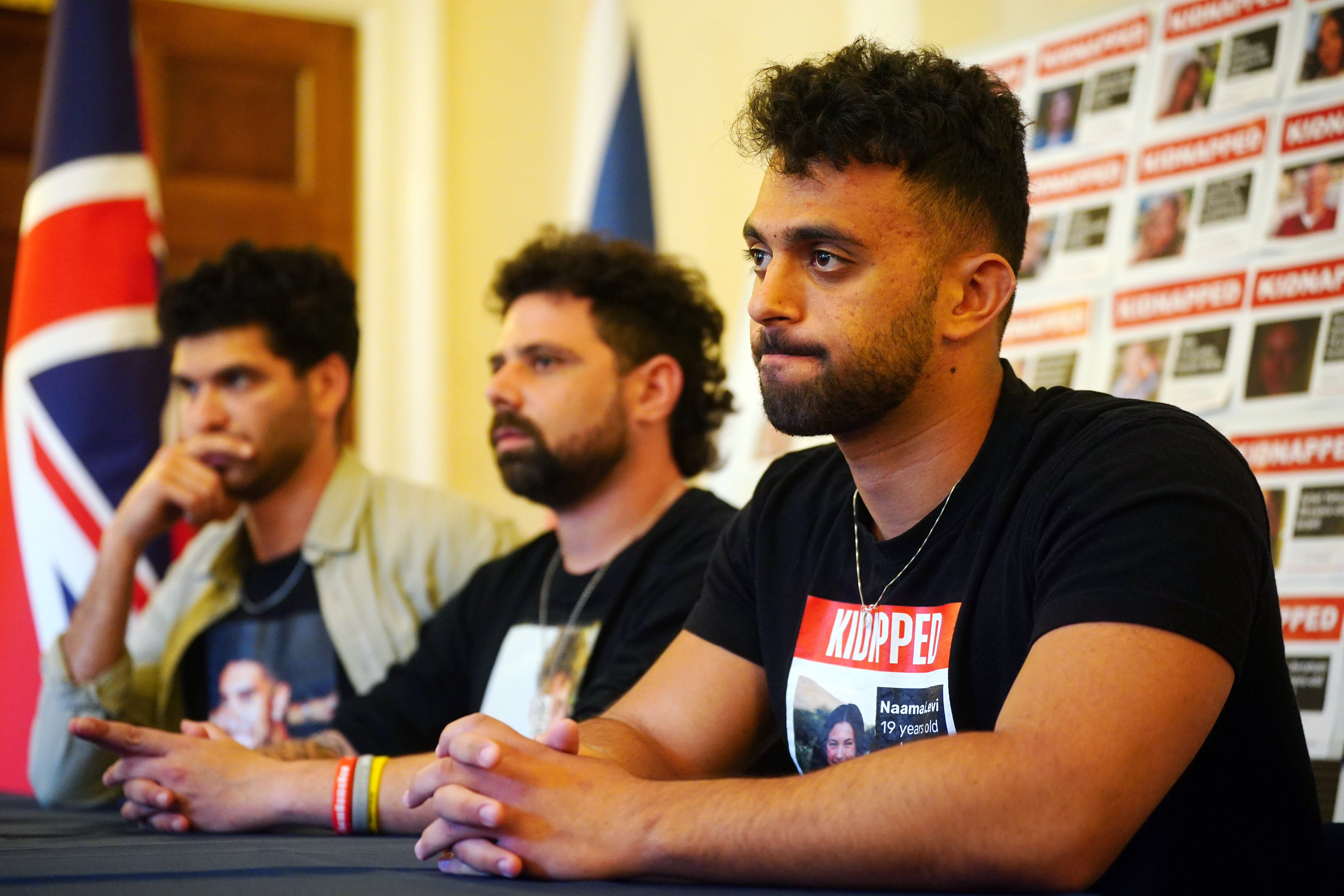 (L-R) Ilay David, brother of hostage Evyatar David, Gal Gilboa Dalal, Nova survivor and brother of Guy Gilboa Dalal, and Amit Levy, brother of Naama Levy, speaking at the Embassy of Israel in London with young family members of hostages currently being held in Gaza
