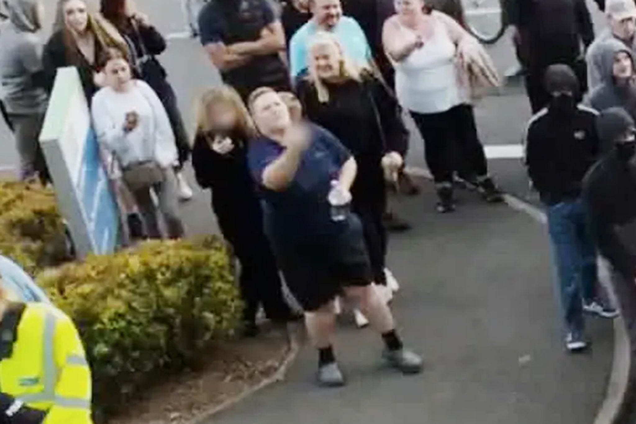 Amy Hodgkinson-Hedgecox was caught on camera gesturing at the riot outside the hote