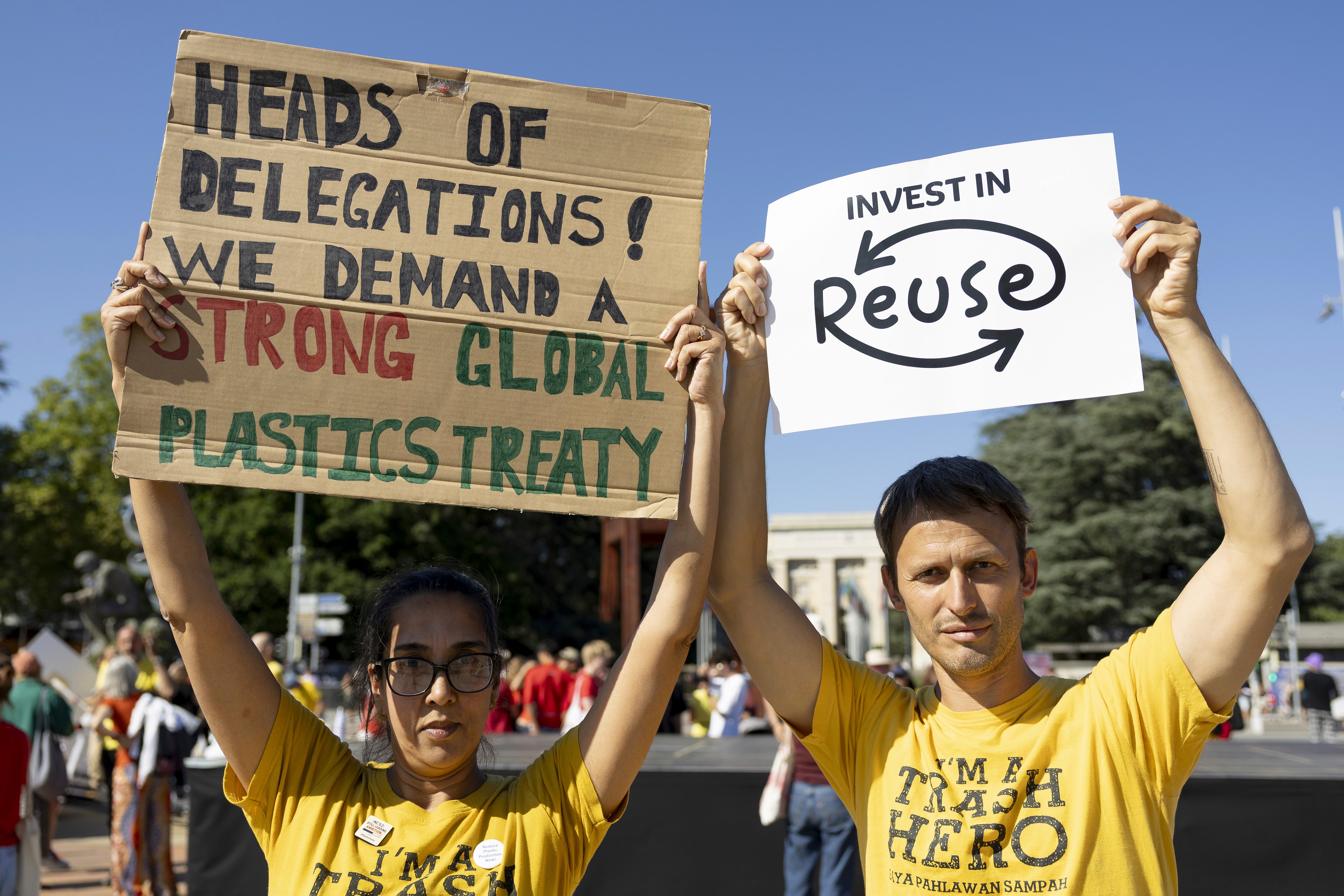 People gather in response to Greenpeace's call to support the plastics treaty on Place des Nations in front of the European headquarters of the United Nations in Geneva, Switzerland