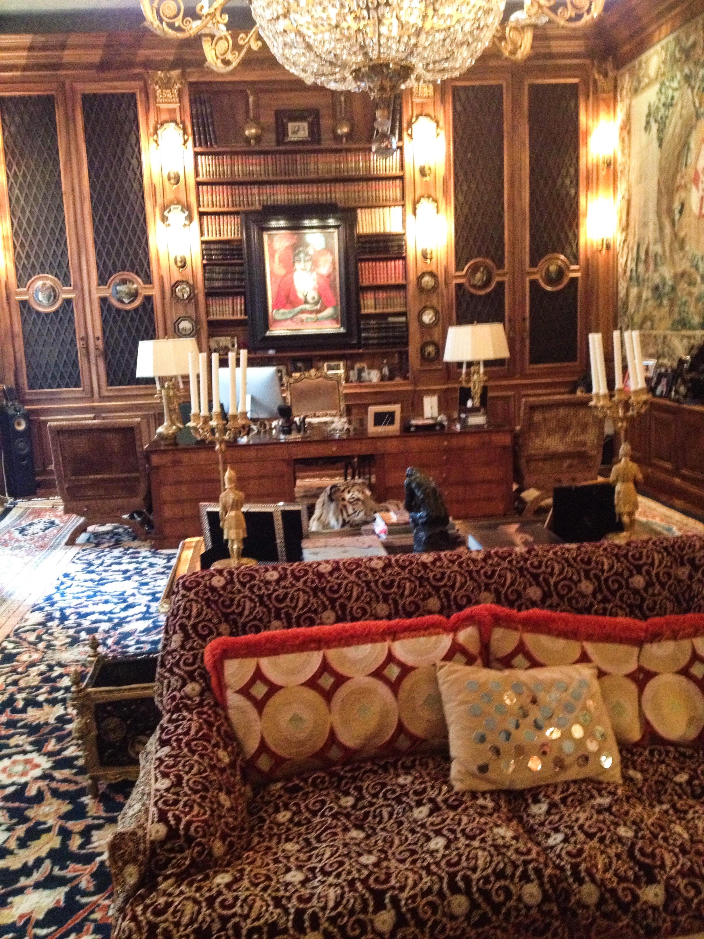 A nude painting is seen inside the mansion, while a tiger can be spotted in the centre of the image