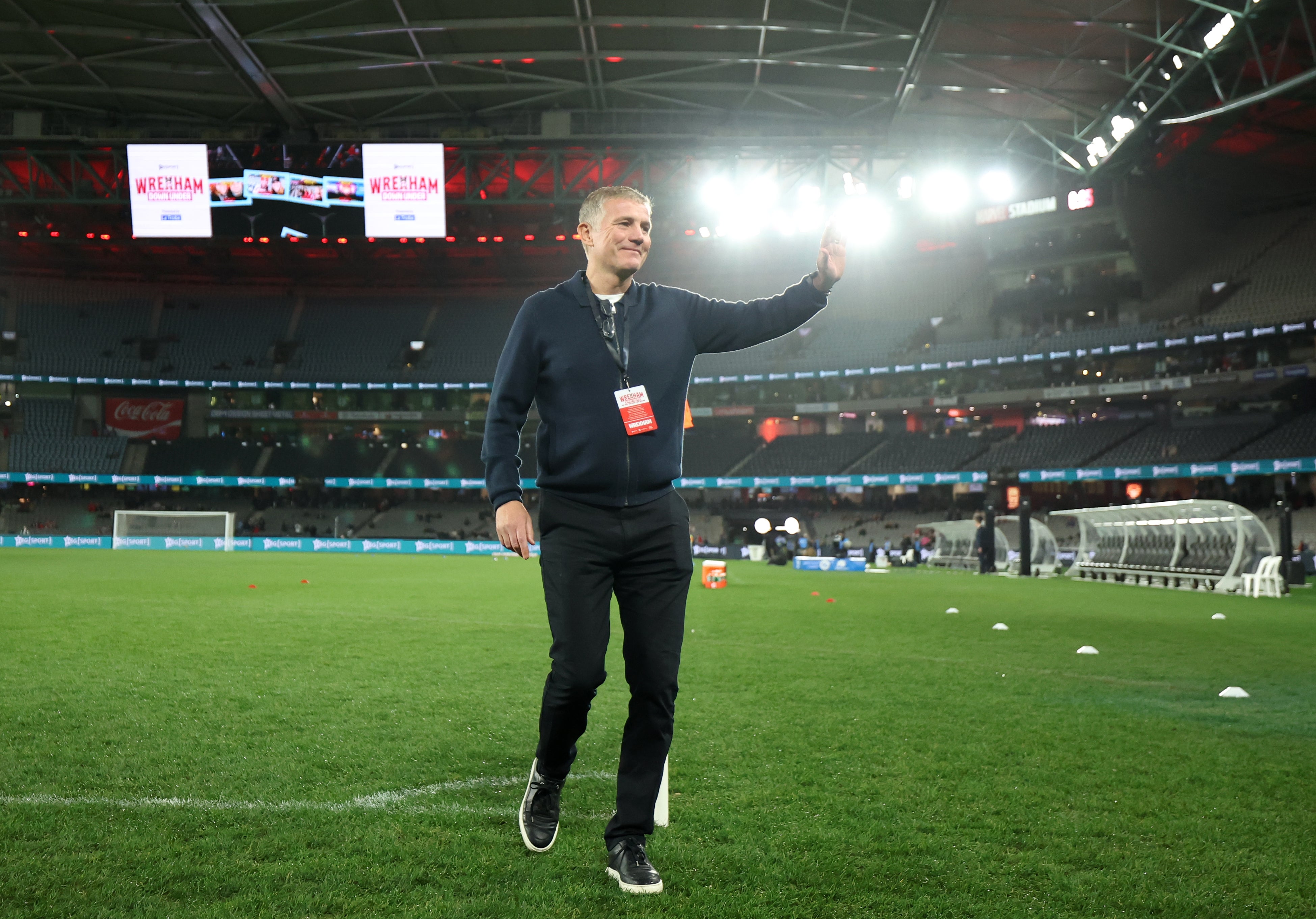 Phil Parkinson waves to the fans on the pre-season tour at Marvel Stadium, Melbourne