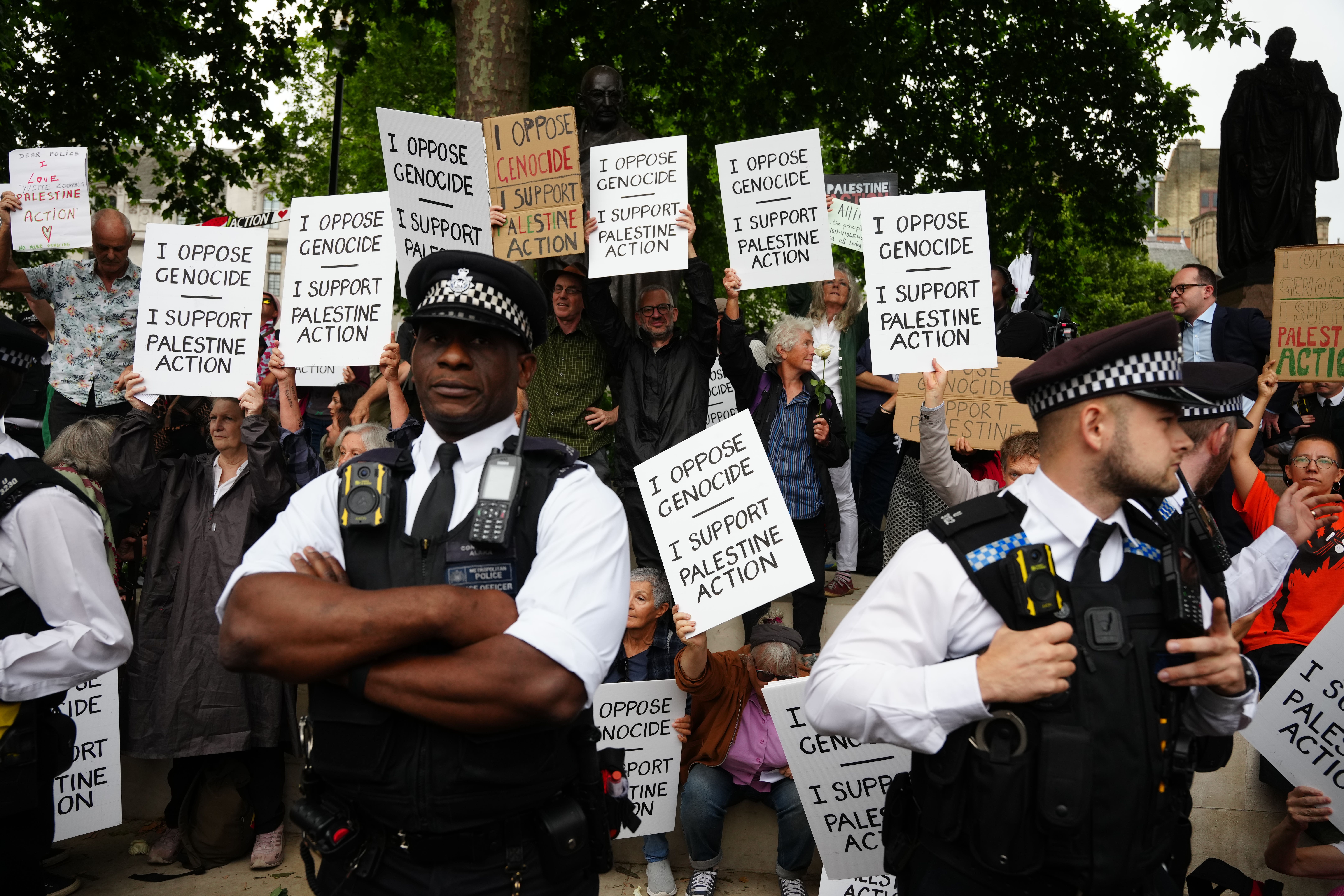Metropolitan Police officers observe a protest in support of Palestine Action (Jeff Moore/PA)