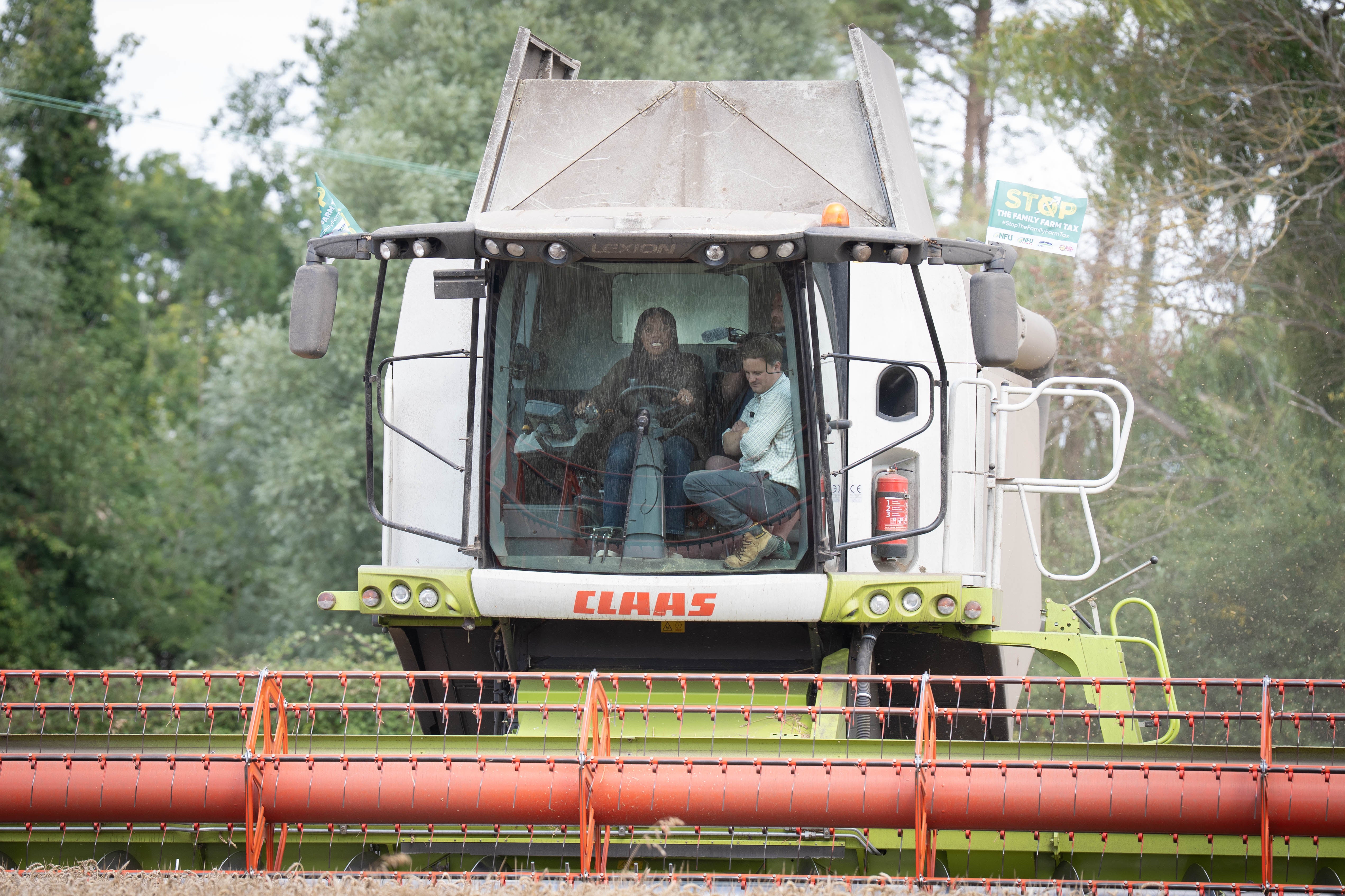 Conservative Party leader Kemi Badenoch drives a combine harvester during her visit (Stefan Rousseau/PA)