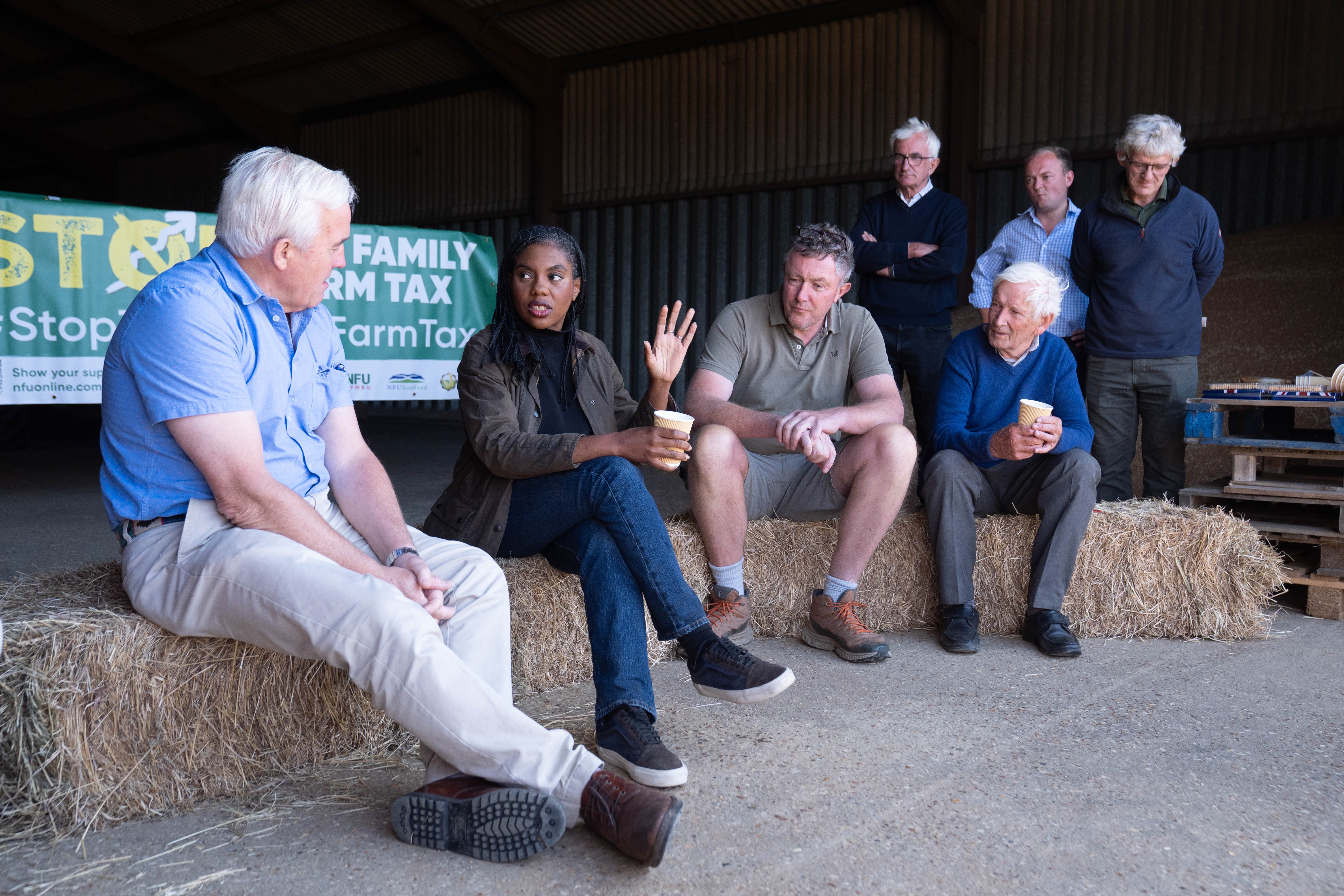 Kemi Badenoch speaks to farmers during her visit to Hall Farm in Little Walden (Stefan Rousseau/PA)