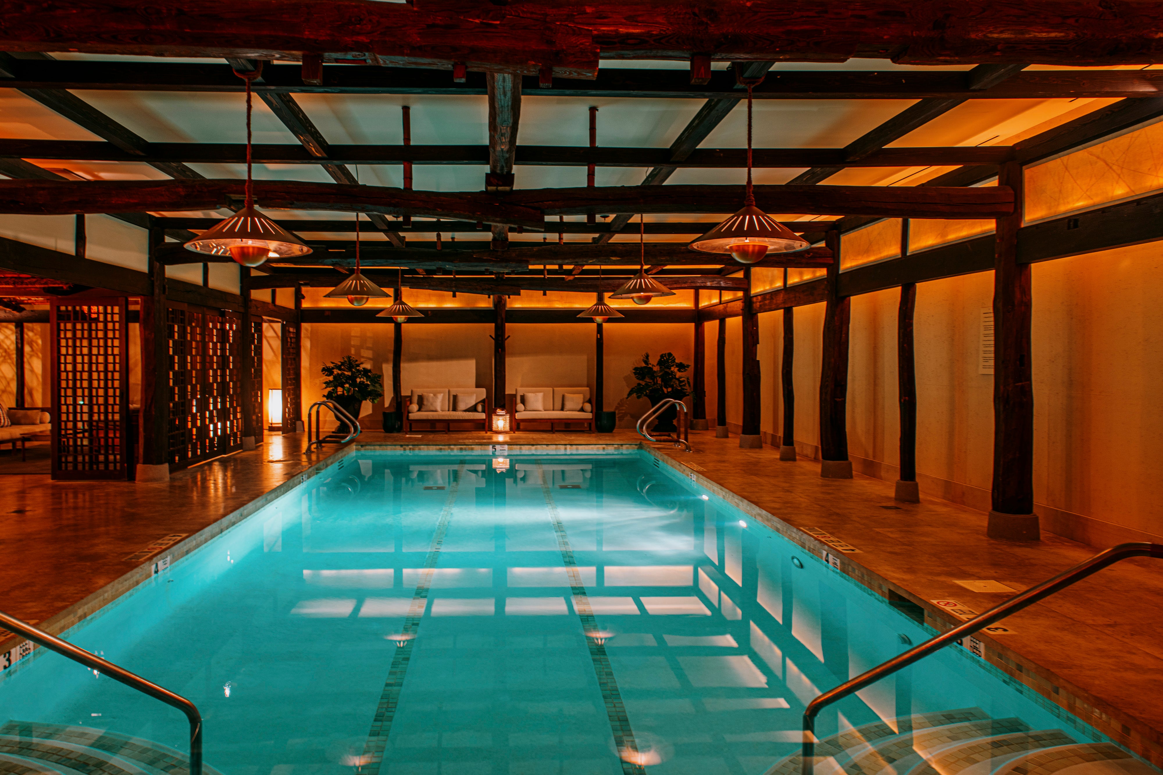 The stunning swimming pool and spa is filled with soft, mood lighting