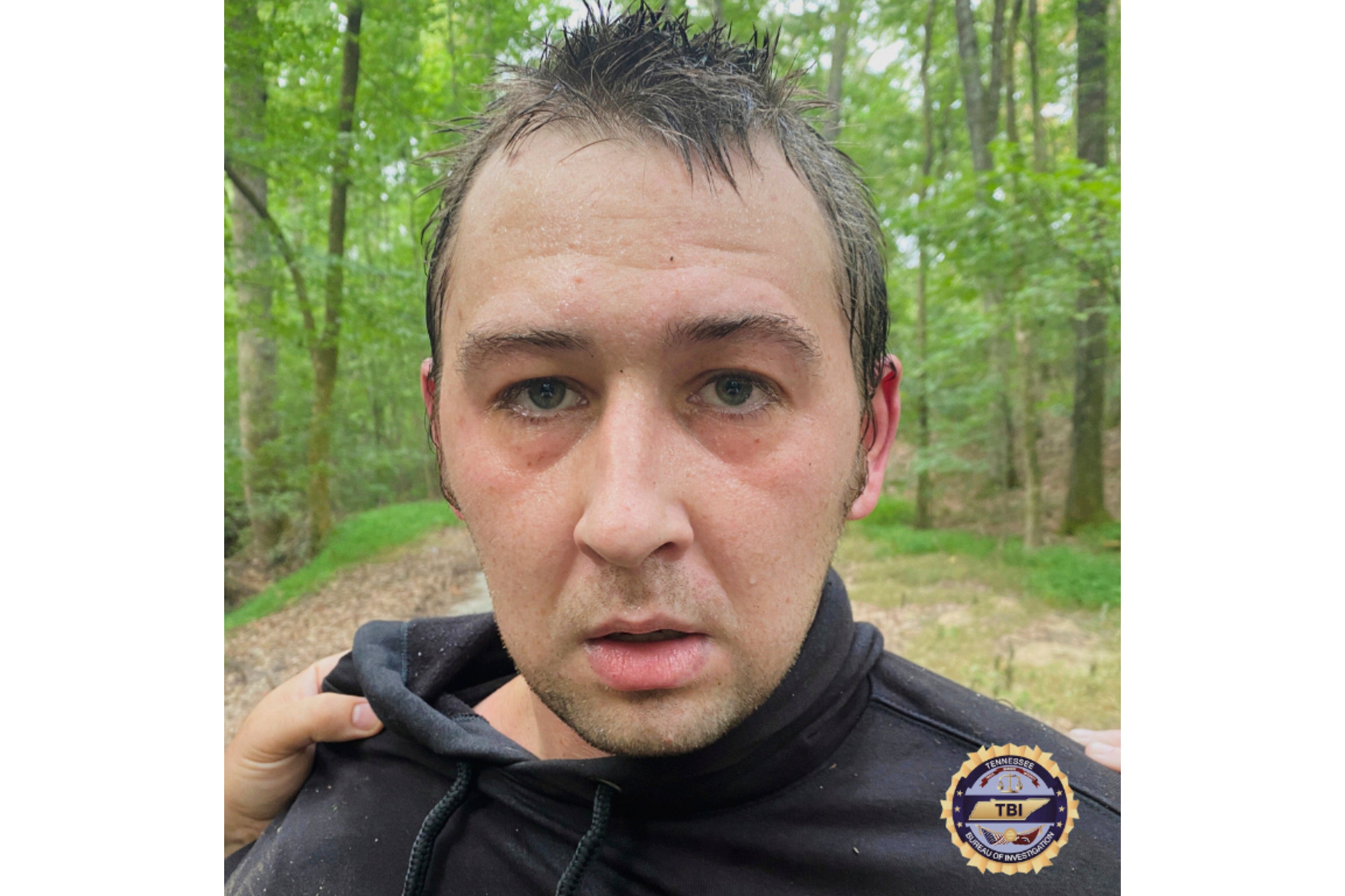 This photo provided by Tennessee Bureau of Investigation on Tuesday, Aug. 5, 2025 shows Austin Drummond, moments after having been taken into custody. Drummond was linked to a quadruple murder last week