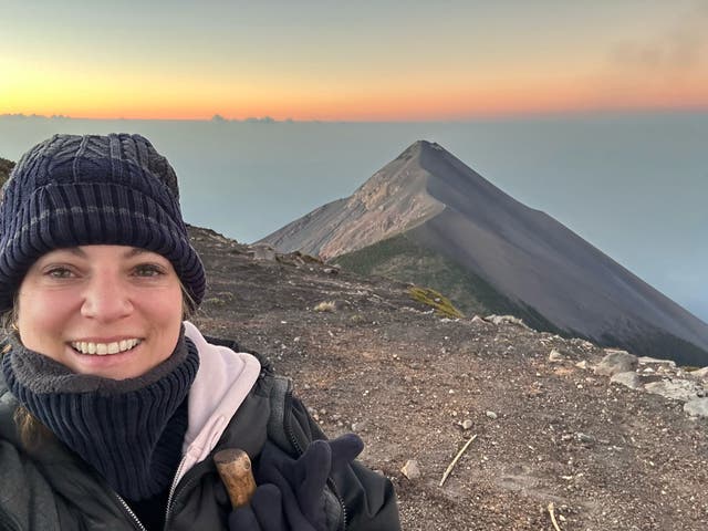 <p>Chloe Steuer in front of Fuego, one of the most active volcanoes in Central America </p>