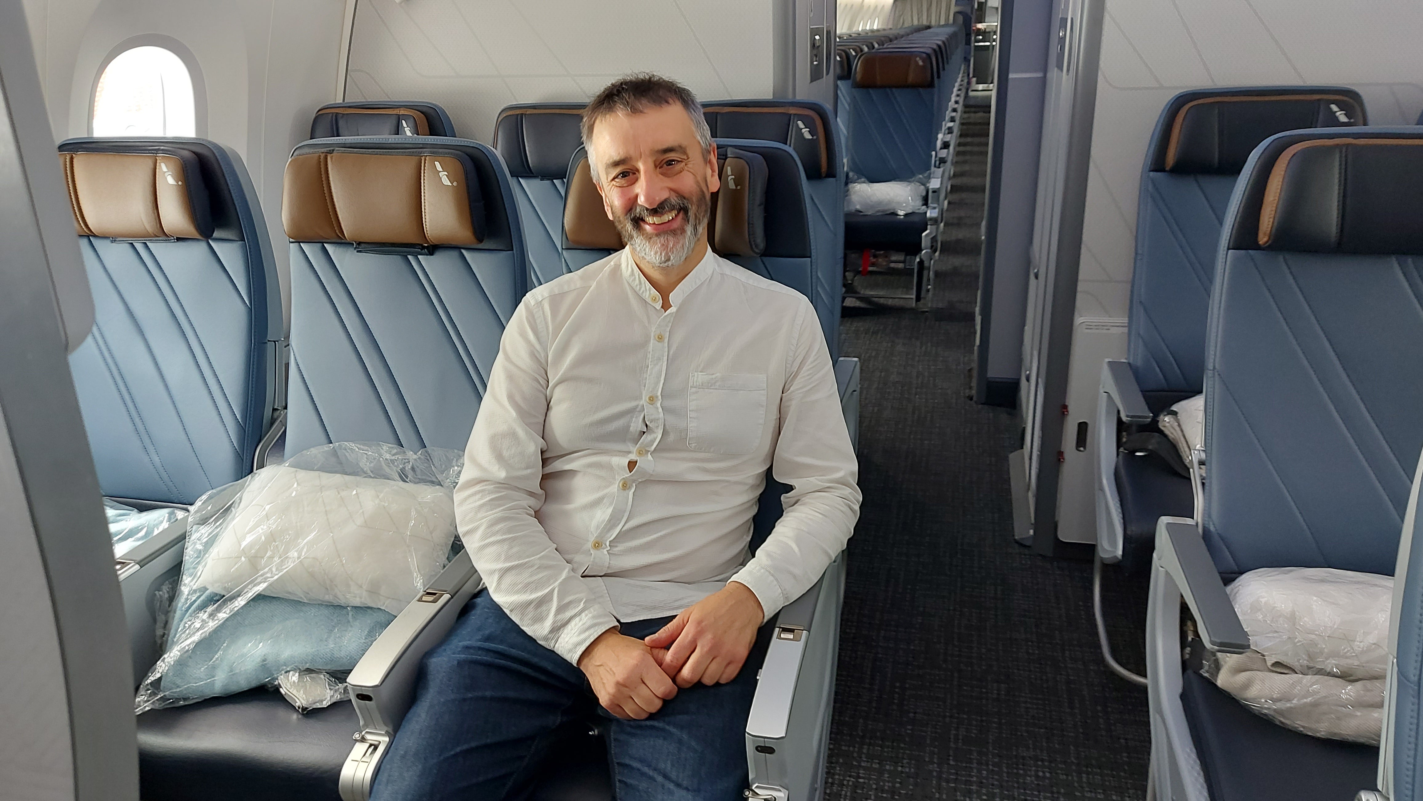 Screens that are 29 percent larger are one notable economy-class improvement