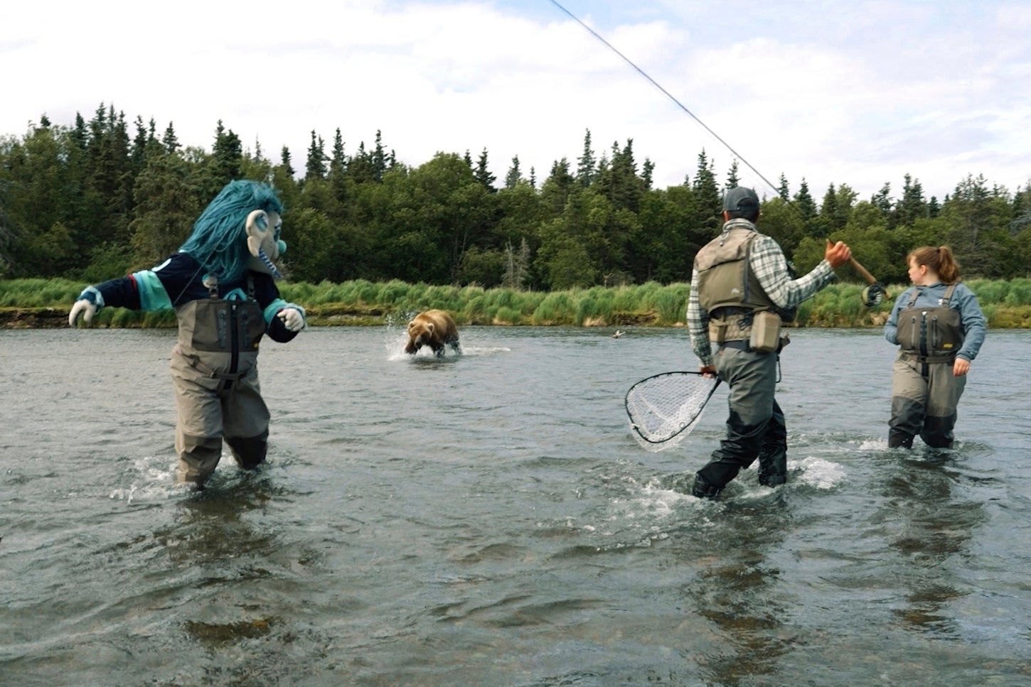 The bear charged at Seattle Kraken’s blue-haired troll mascot, named Buoy, and forward John Hayden in Katmai National Park