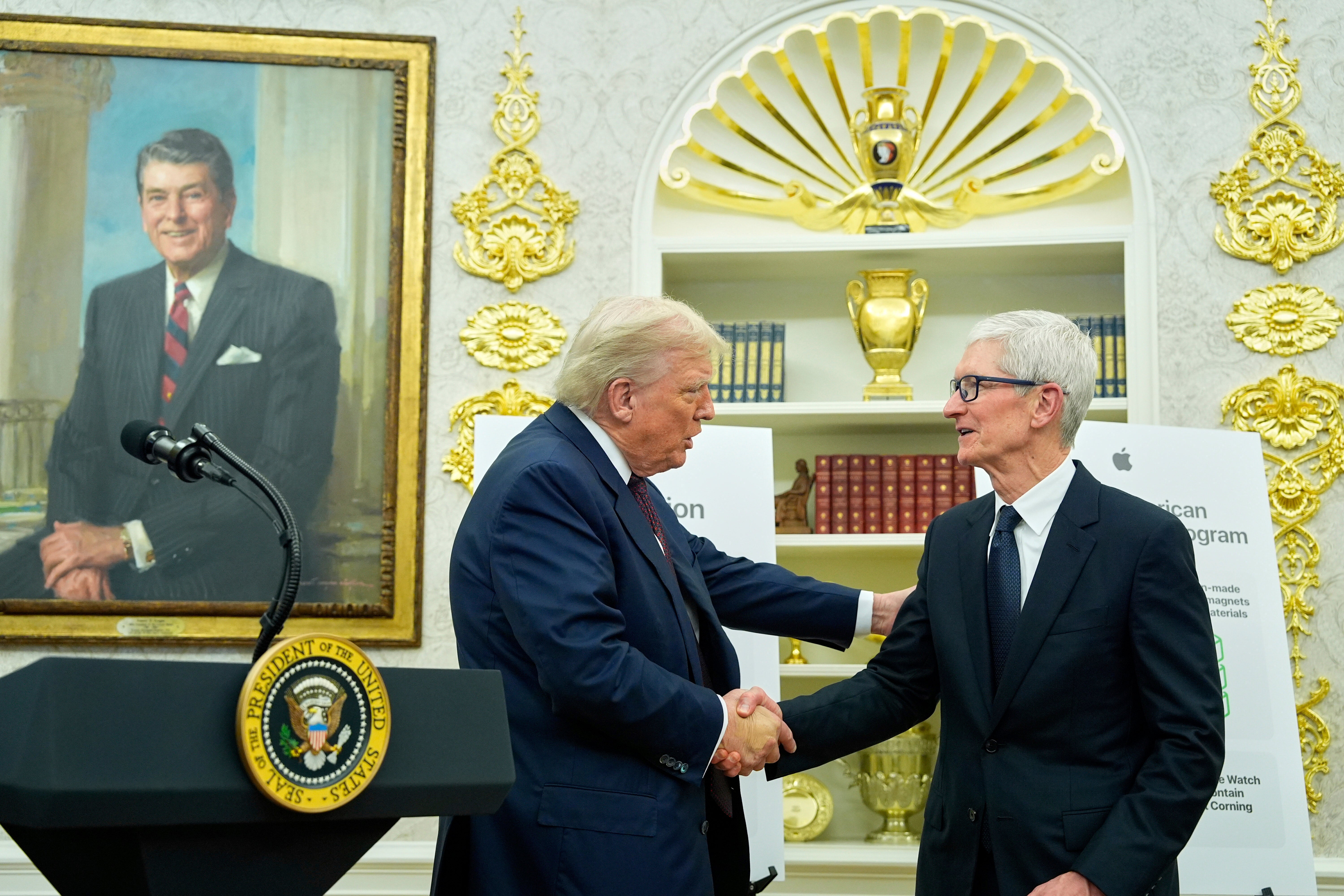 <p>President Donald Trump welcomes Apple CEO Tim Cook to the Oval Office in August</p>