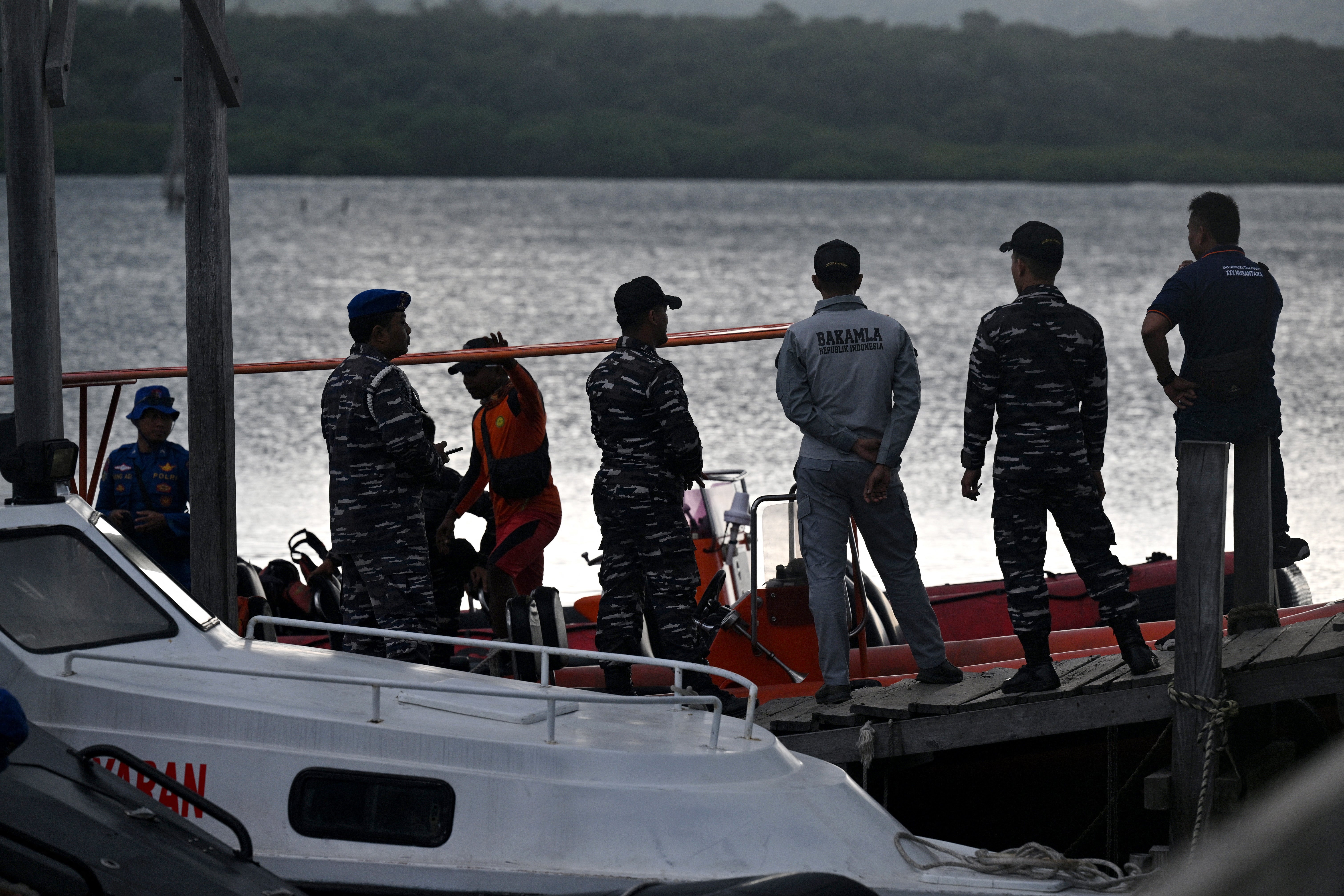 Indonesian rescuers search for missing victims of a ferry accident in the waters off the Bali Strait near Jembrana
