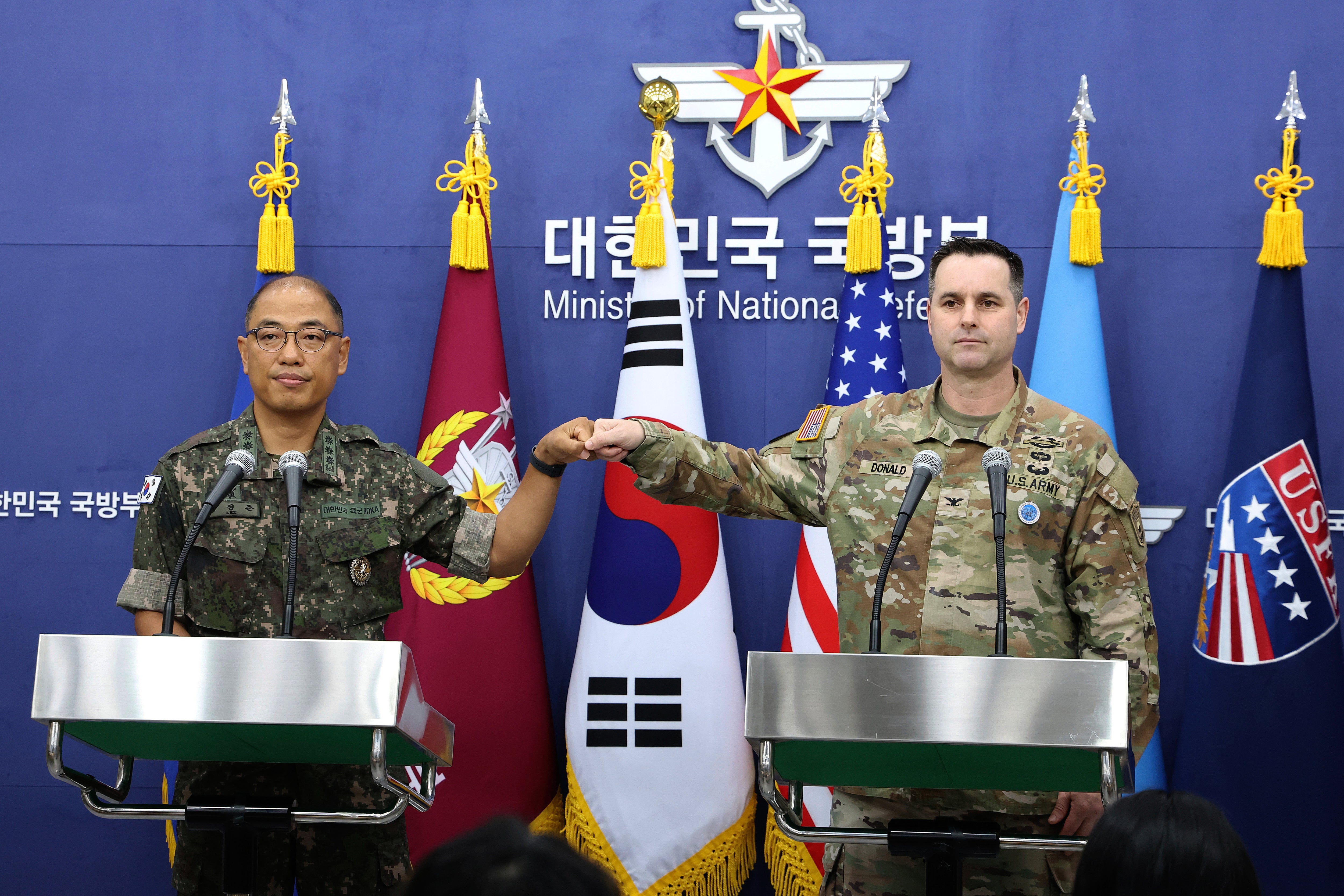 Col. Lee Sung-jun, left, public affairs director of South Korea's Joint Chiefs of Staff and Col. Ryan Donald, public affairs director of the United Nations Command (UNC), Combined Forces Command (CFC), and United States Forces Korea (USFK) attend a press briefing of Ulchi Freedom Shield 2025 exercise at the Defense Ministry in Seoul Thursday, Aug. 7, 2025. (Chung Sung-Jun/Pool Photo via AP)