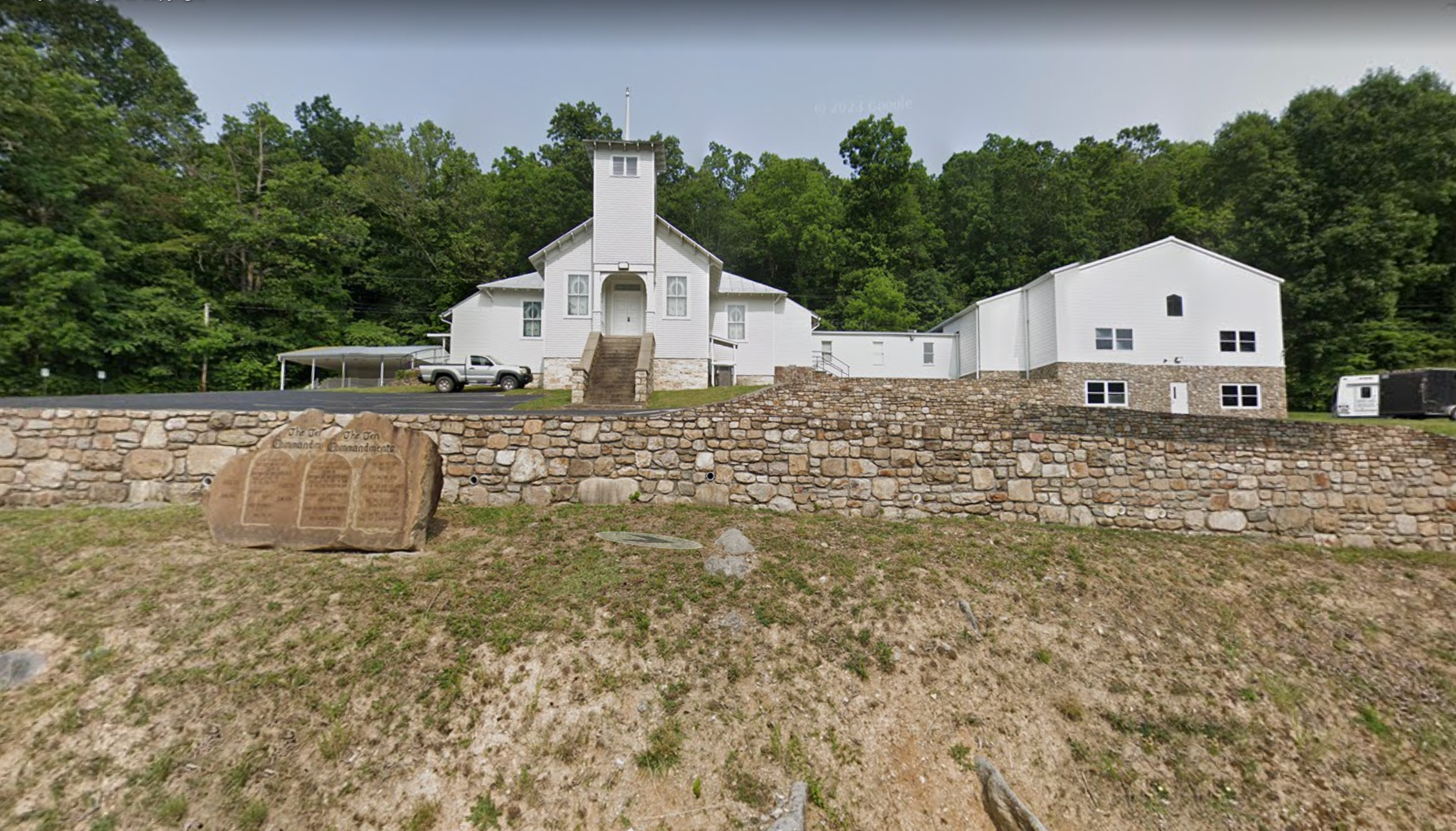 The Catawba Valley Baptist Church in Troutville, Virginia, with the Ten Commandments etched into a rock outside, where 'Pastor Jake' Barnett led the flock until his Wednesday arrest. He is accused of soliciting explicit photos and videos from teenage girls.