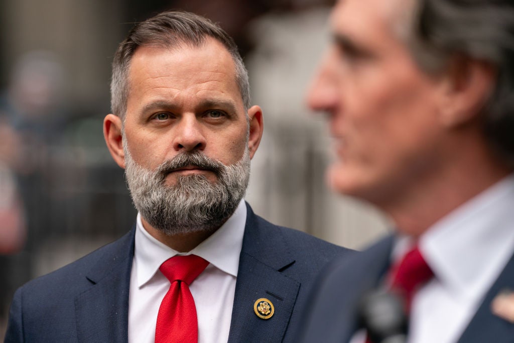 Cory Mills looks on at a press conference. He's being accused by Miss United States of sextortion, which he denies