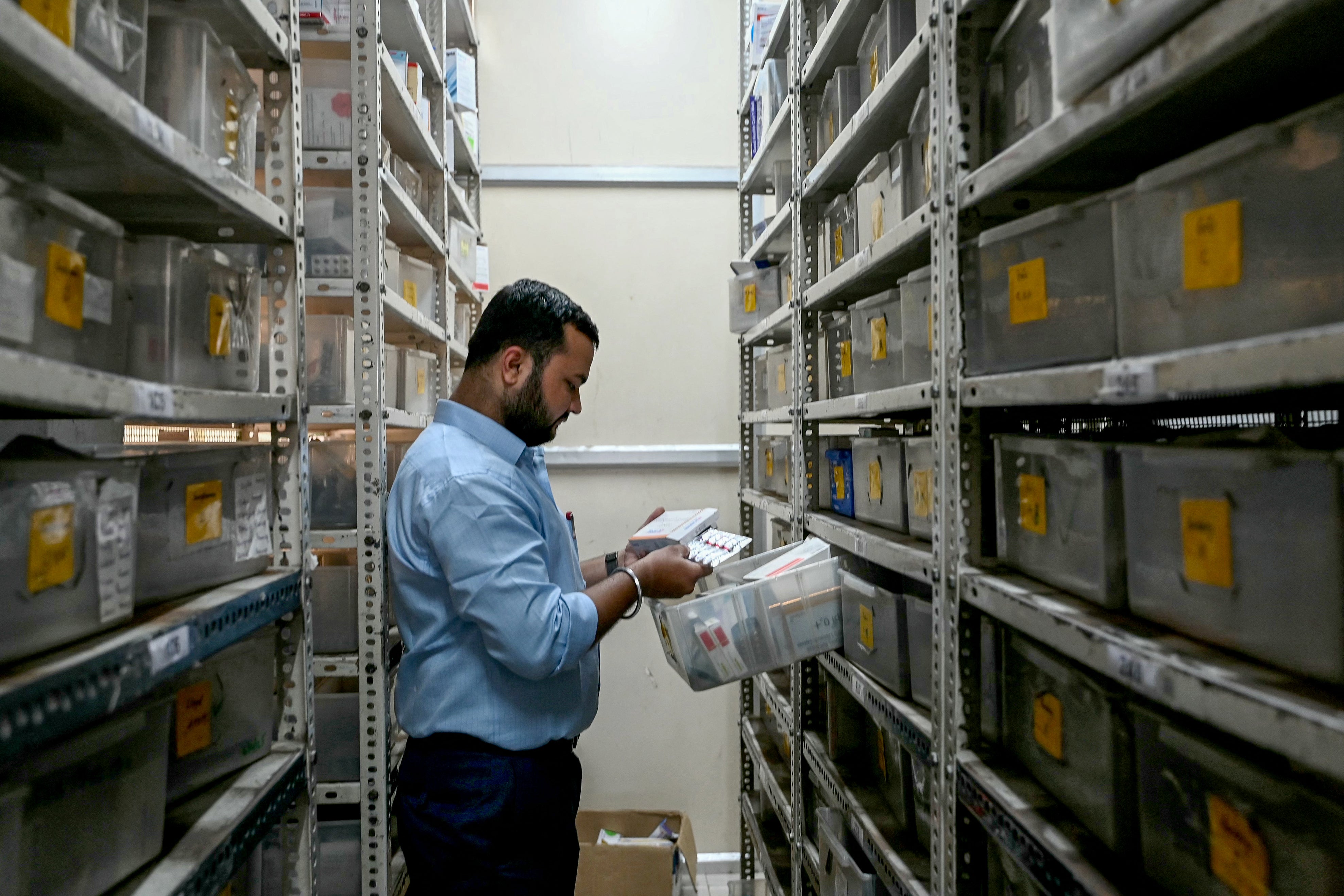 Representative. A pharmacist checks the stock of medicines at a pharmacy store in Hyderabad, India, on 31 July 2025