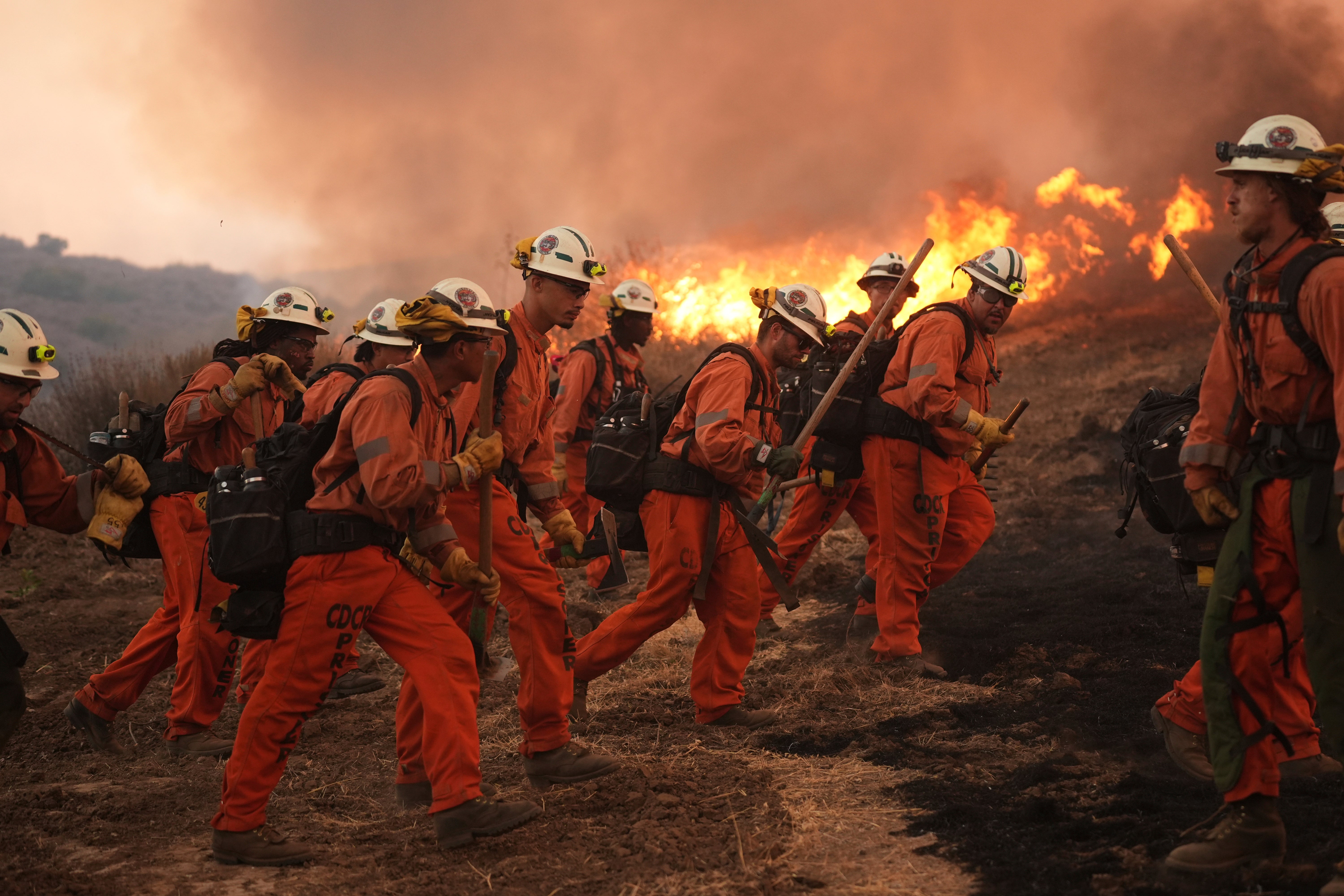 A fire crew from the California Department of Corrections fight the Canyon Fire