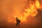 Thousands forced to evacuate in Southern California as fast-moving fire spreads