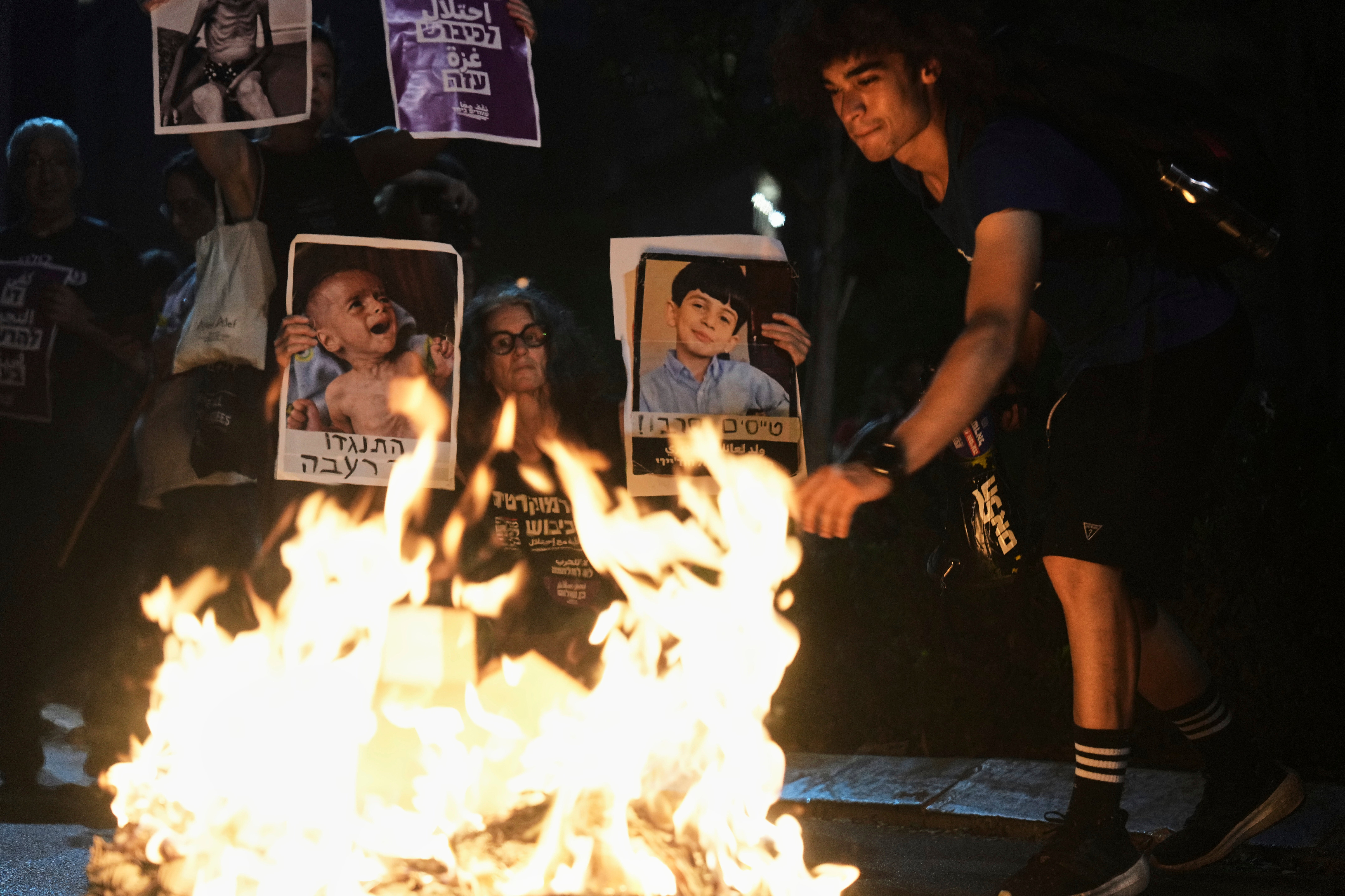 Israeli activists in Tel Aviv protest against the war in the Gaza Strip, Israel's measures regarding food distribution and the forced displacement