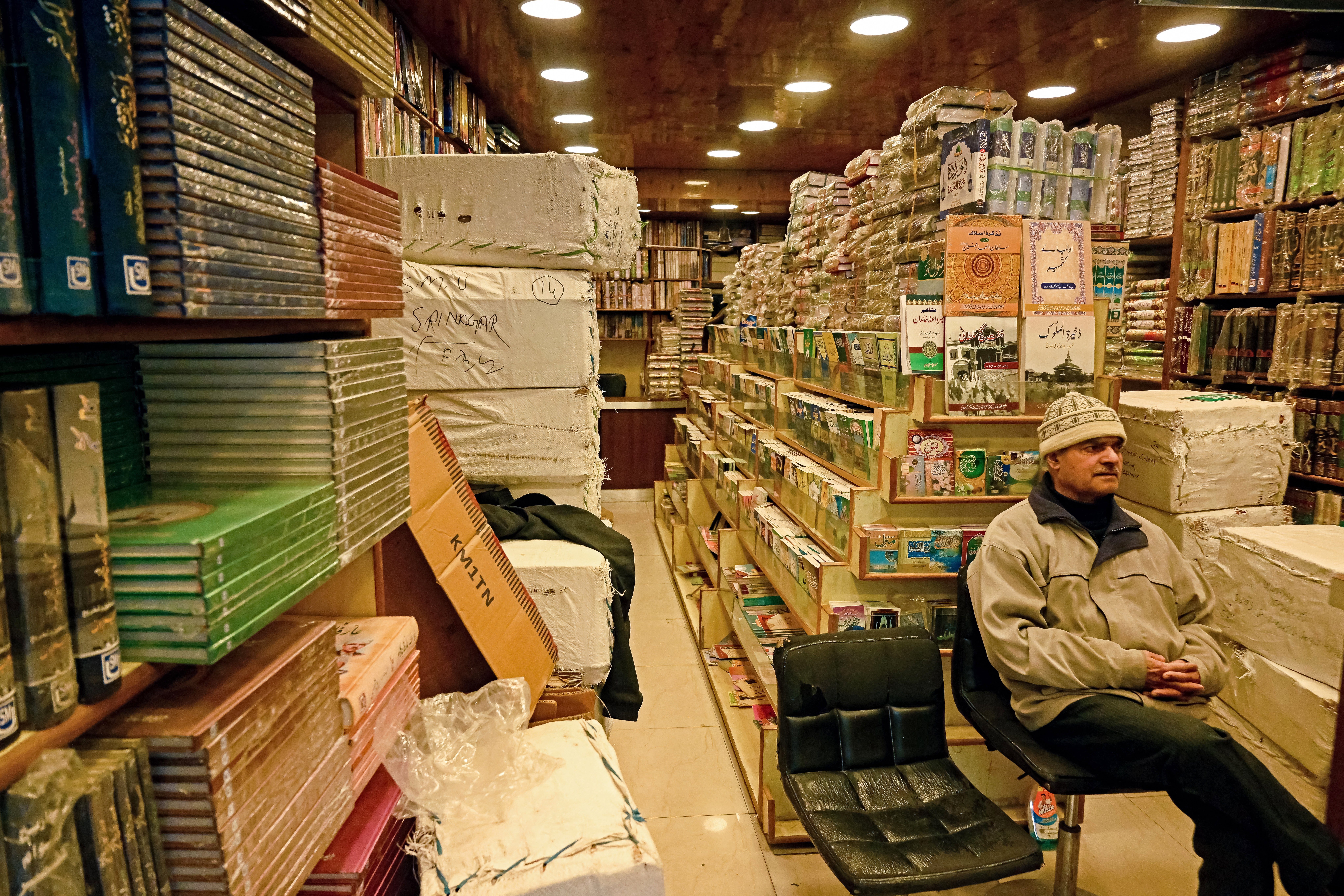 File: Shopkeeper waits for customers at a bookshop in Srinagar on 18 February 2025